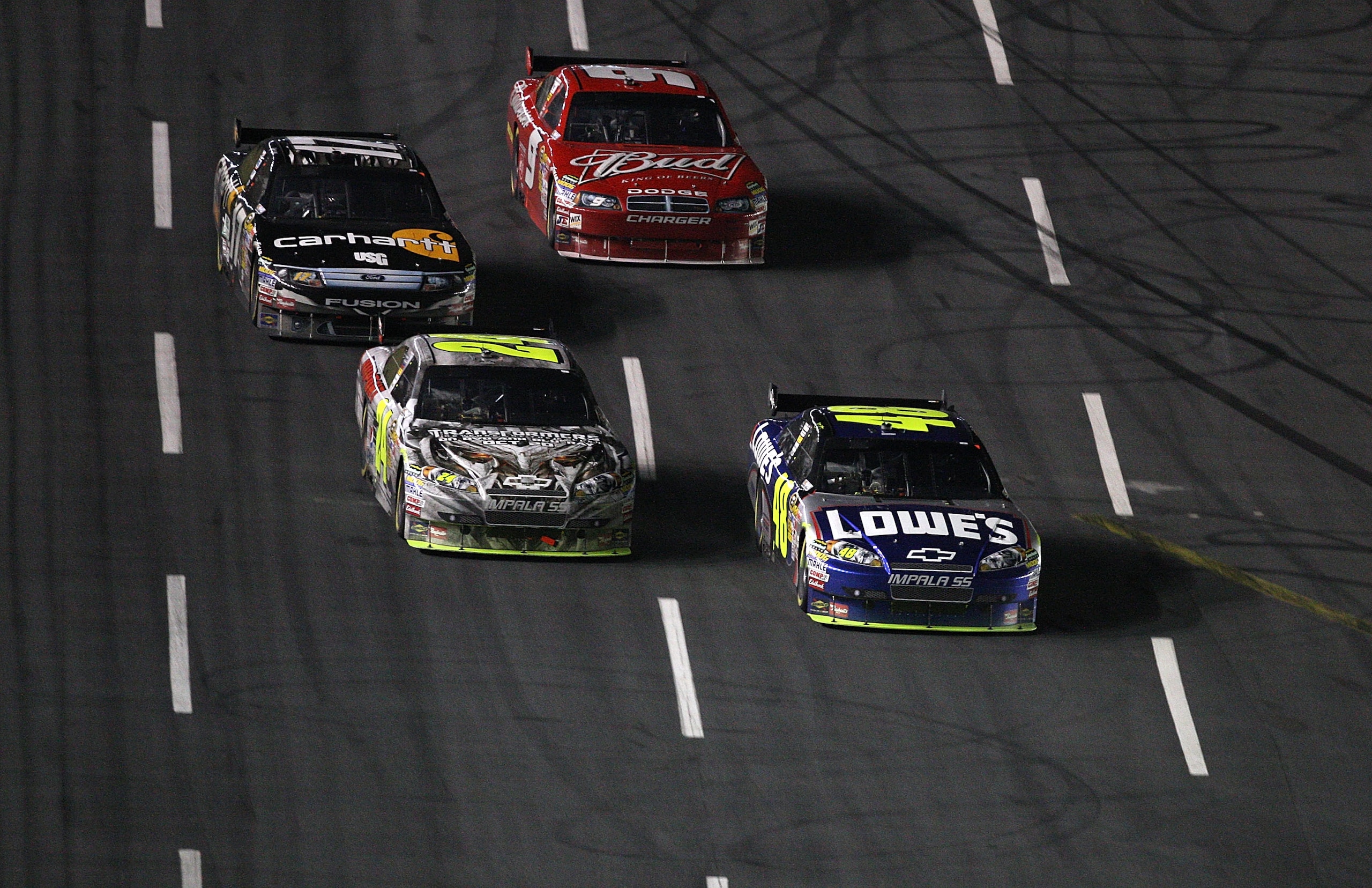 CONCORD, NC - OCTOBER 17: Jimmie Johnson, driver of the #48 Lowe's Chevrolet, races Jeff Gordon, driver of the #24 DuPont/Transformers 2 Chevrolet, Matt Kenseth, driver of the #17 Carhartt Ford, and Kasey Kahne, driver of the #9 Bedweiser Dodge, during t CONCORD, NC - OCTOBER 17: Jimmie Johnson, driver of the #48 Lowe's Chevrolet, races Jeff Gordon, driver of the #24 DuPont/Transformers 2 Chevrolet, Matt Kenseth, driver of the #17 Carhartt Ford, and Kasey Kahne, driver of the #9 Bedweiser Dodge, during t