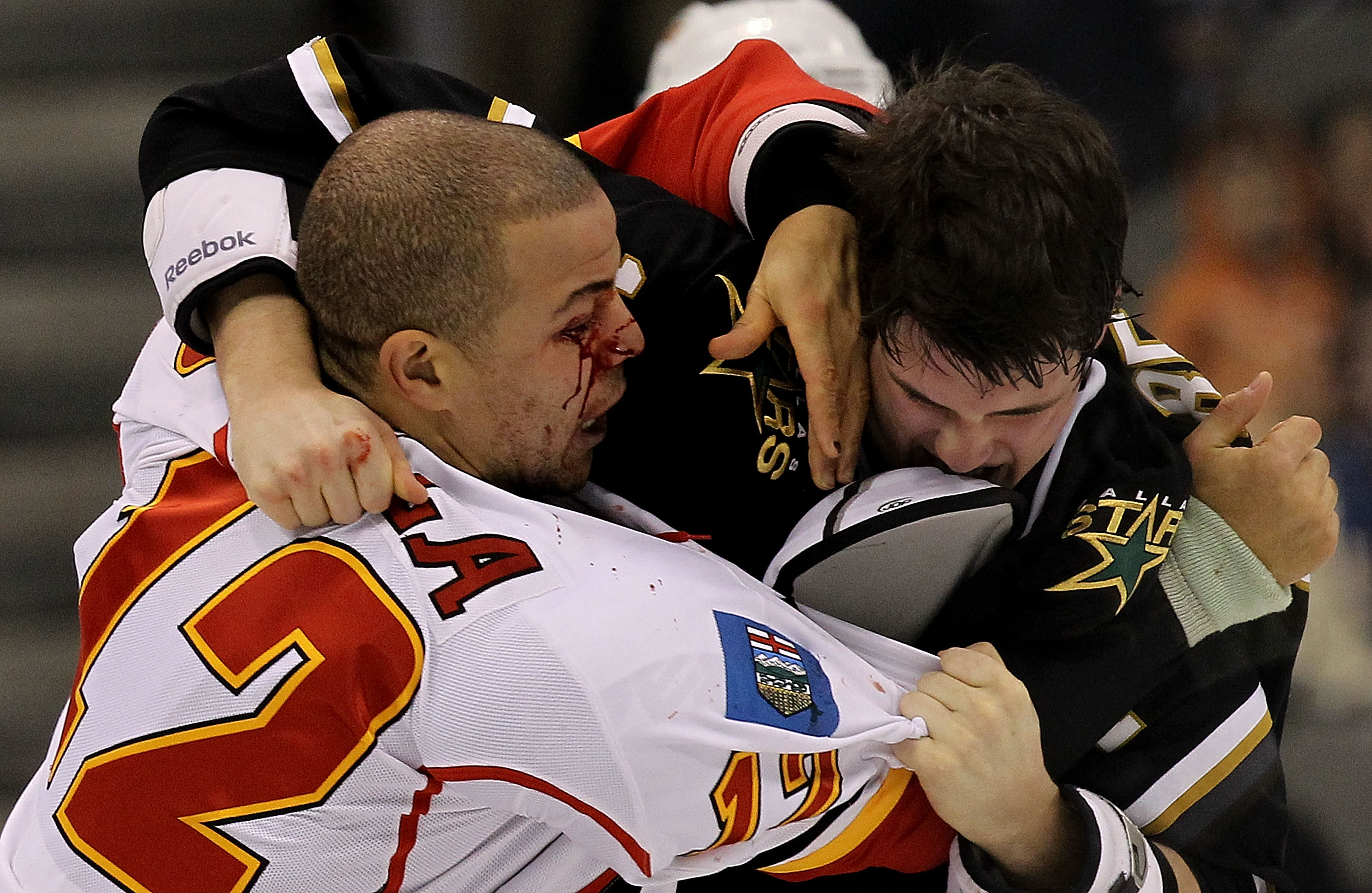 DALLAS, TX - DECEMBER 23:  Right wing Jarome Iginla #12 of the Calgary Flames fights with Jamie Benn #14 of the Dallas Stars at American Airlines Center on December 23, 2010 in Dallas, Texas.  (Photo by Ronald Martinez/Getty Images)