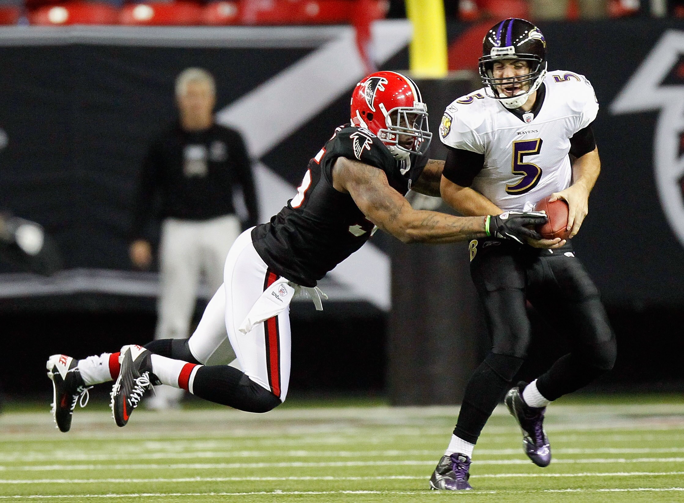 ATLANTA - NOVEMBER 11:  John Abraham #55 of the Atlanta Falcons sacks quarterback Joe Flacco #5 of the Baltimore Ravens at Georgia Dome on November 11, 2010 in Atlanta, Georgia.  (Photo by Kevin C. Cox/Getty Images)