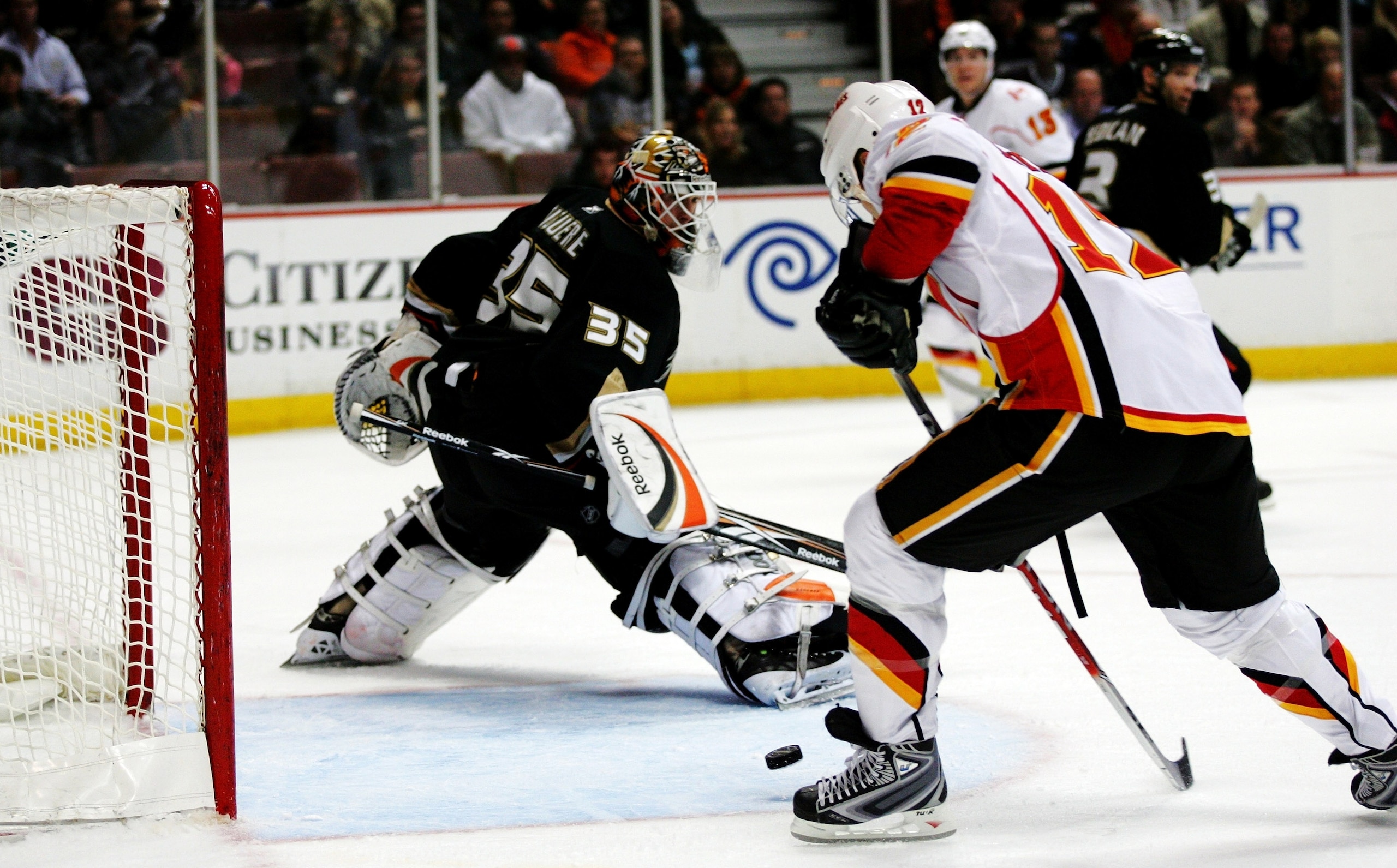 ANAHEIM, CA - FEBRUARY 11: Jarome Iginla #12 of the Calgary Flames shoots the puck past Jean-Sebastian Giguere of the Anaheim Ducks during the game on February 11, 2009 at the Honda Center in Anaheim, California.  (Photo by Victor Decolongon/Getty Images)