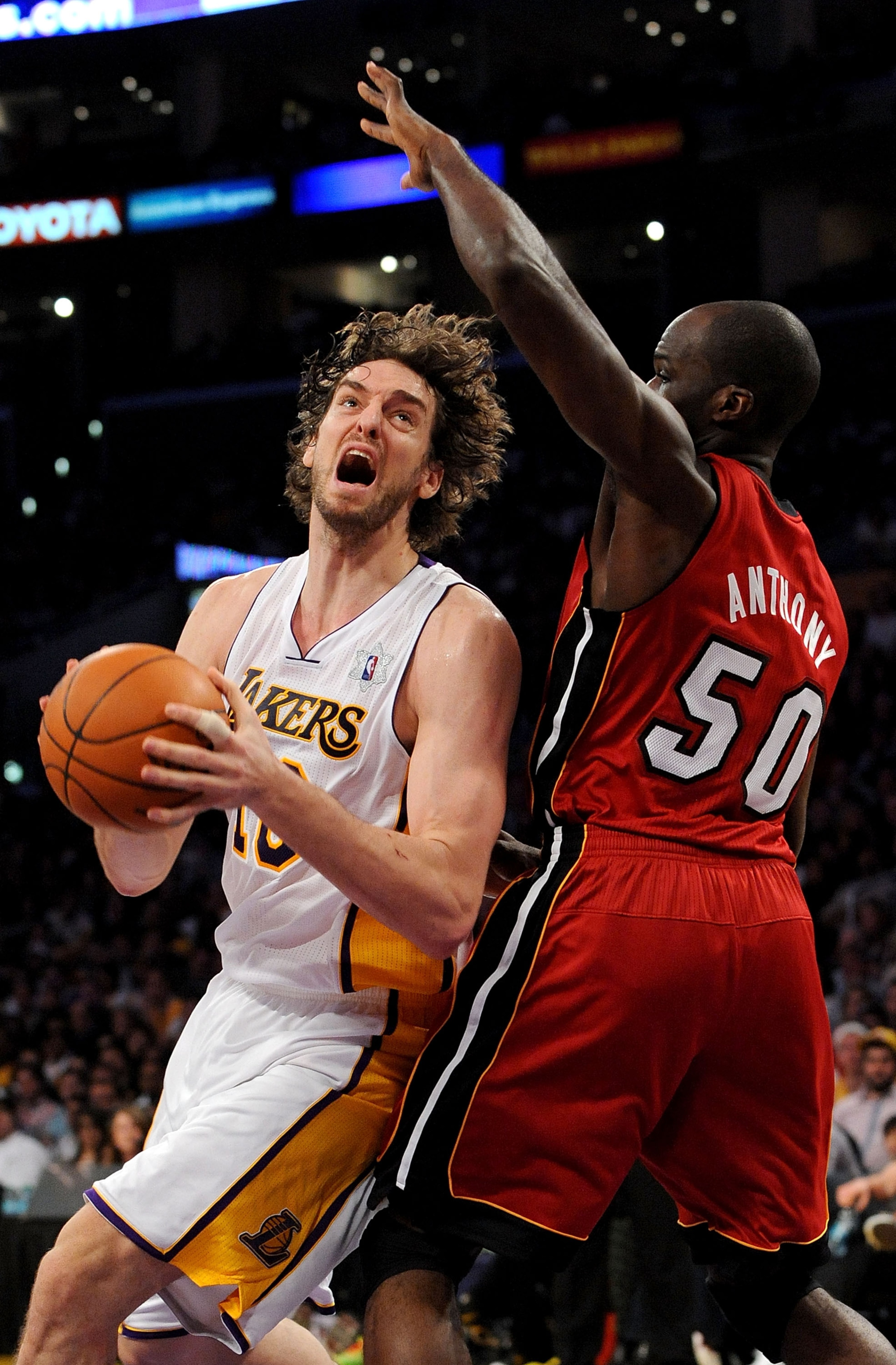 LOS ANGELES, CA - DECEMBER 25:  Pau Gasol #16 of the Los Angeles Lakers drives to the basket against Joel Anthony #50 of the Miami Heat at Staples Center on December 25, 2010 in Los Angeles, California. NOTE TO USER: User expressly acknowledges and agrees