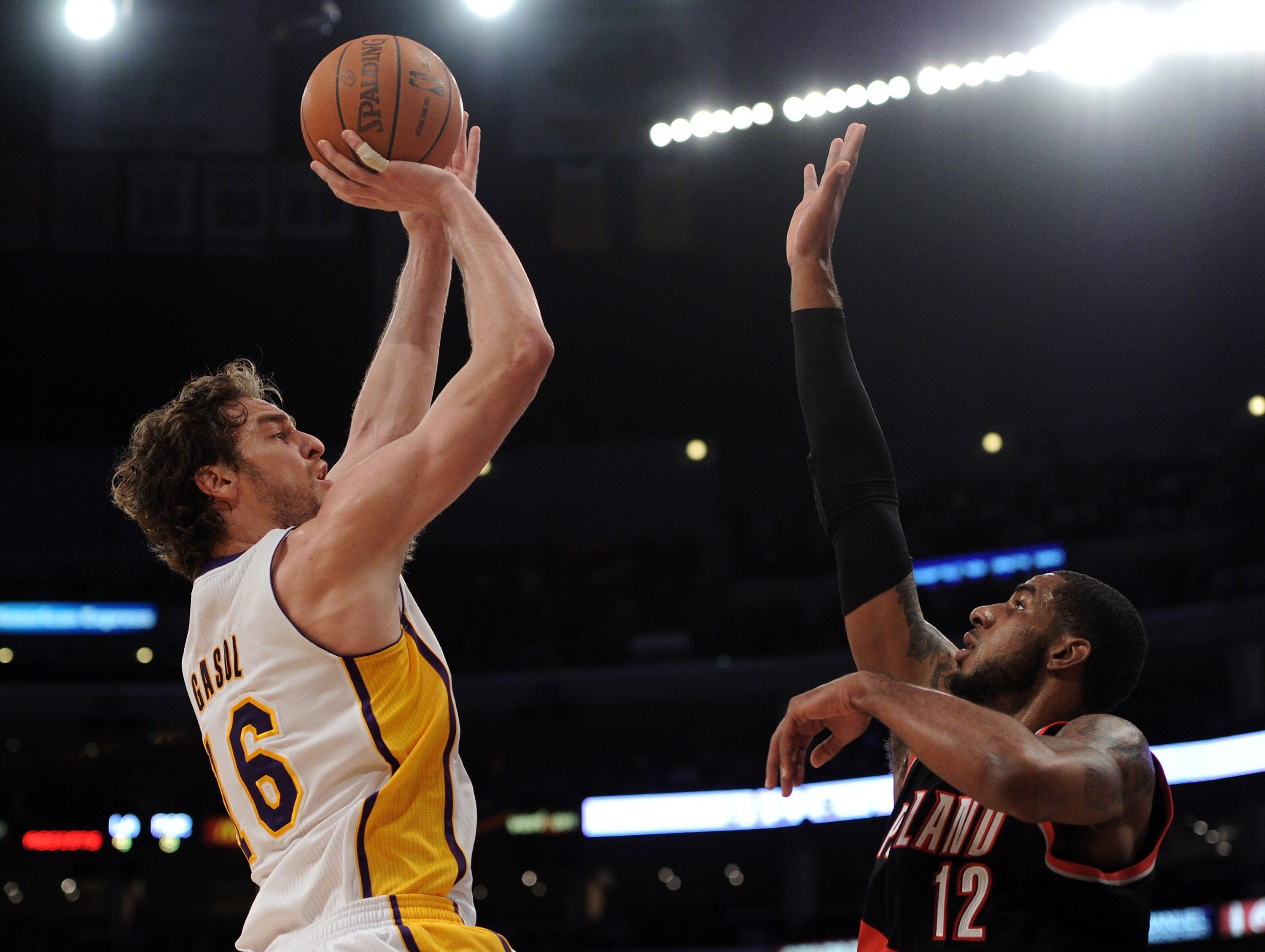 LOS ANGELES, CA - NOVEMBER 07:  Pau Gasol #16 of the Los Angeles Lakers shoots a jumper over LaMarcus Aldridge #12 of the Portland Trail Blazers at the Staples Center on November 7, 2010 in Los Angeles, California.  NOTE TO USER: User expressly acknowledg