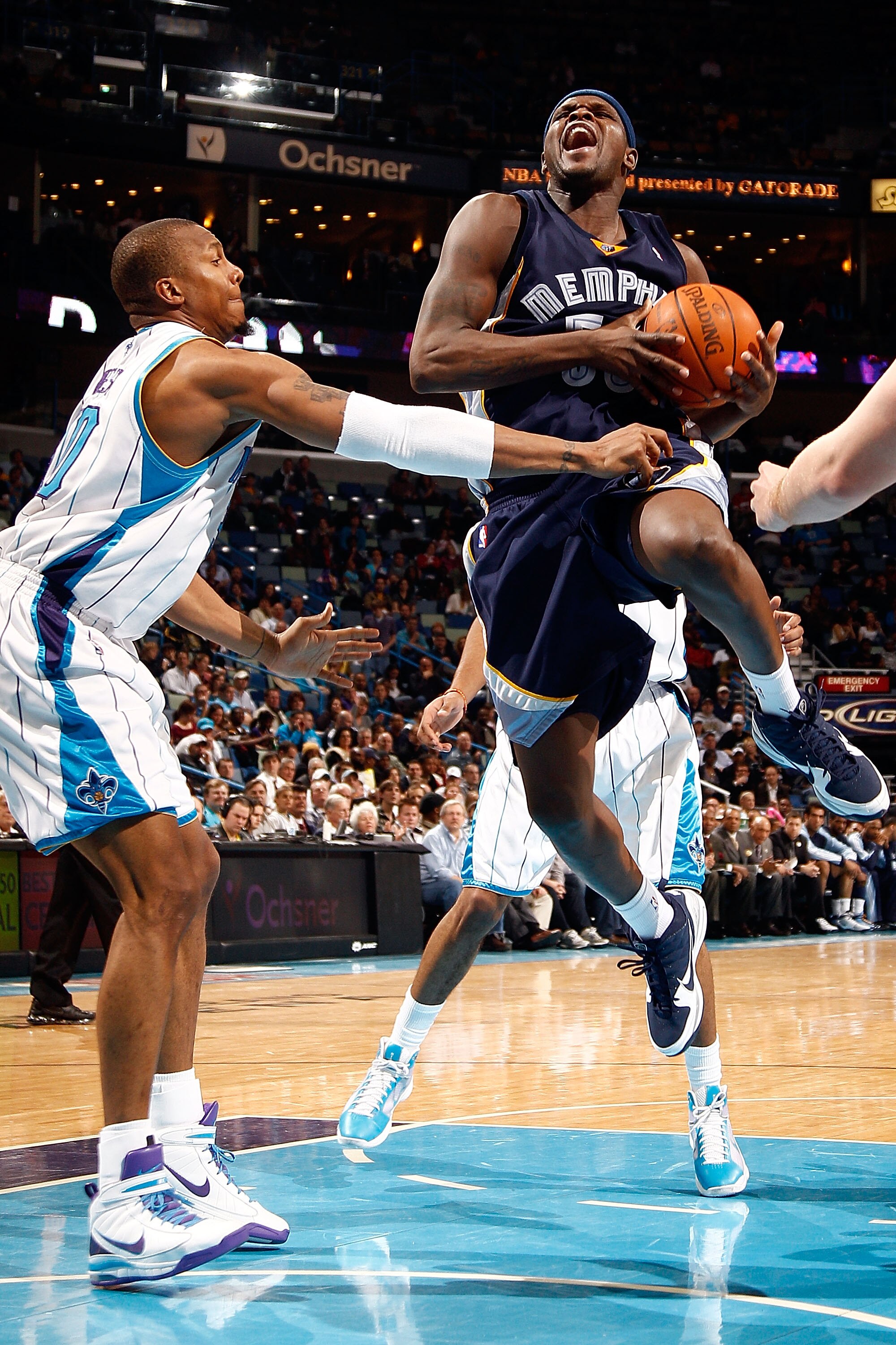 NEW ORLEANS - MARCH 03:  Zach Randolph #50 of the Memphis Grizzlies is fouled by David West #30 of the New Orleans Hornets at the New Orleans Arena on March 3, 2010 in New Orleans, Louisiana.  The Grizzlies defeated the Hornets 104-100.  NOTE TO USER: Use
