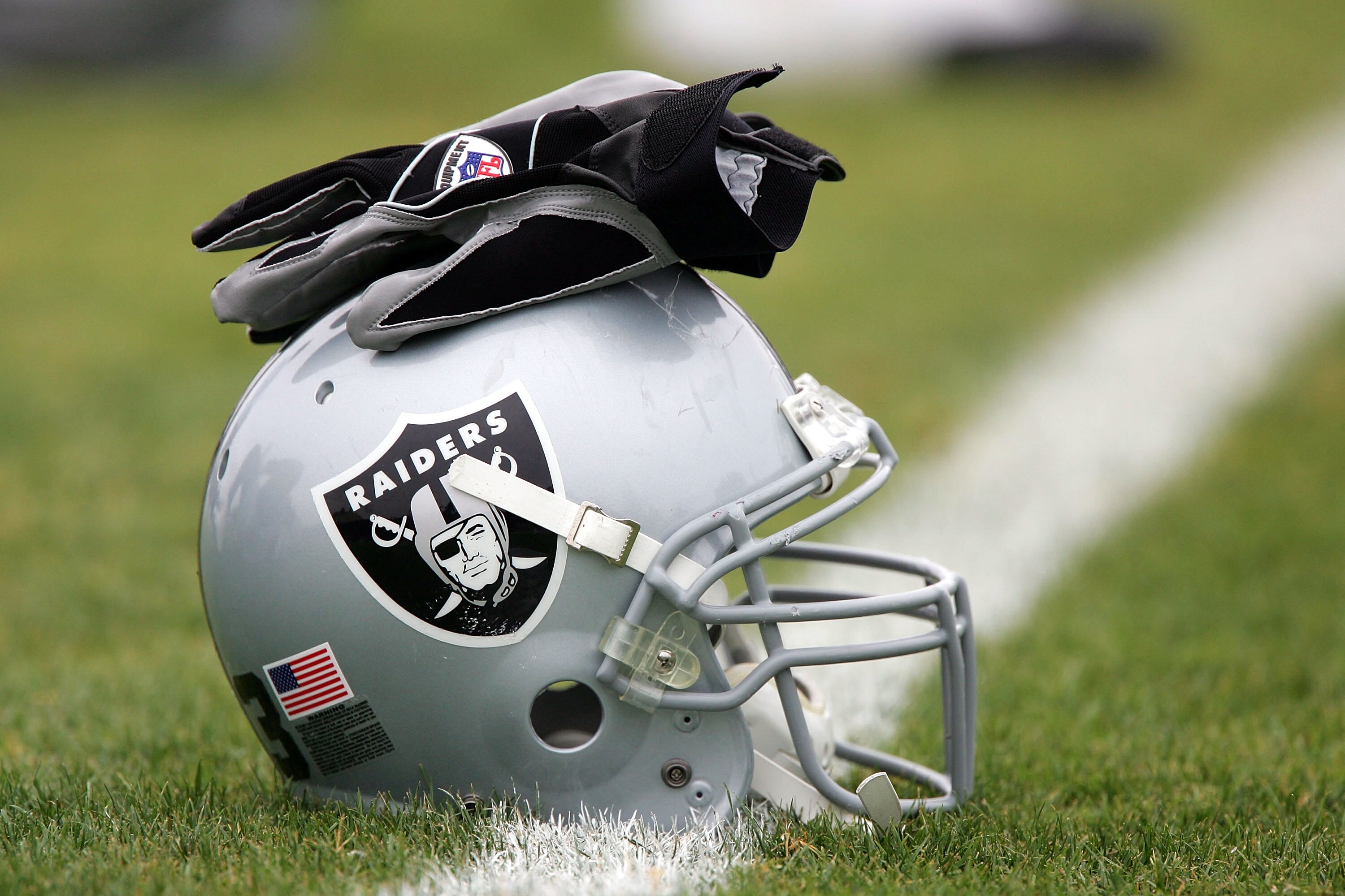 NAPA, CA - AUGUST 3:  A detail shot of a helmet and gloves during the Oakland Raiders Training Camp at the Napa Valley Marriot on August 3, 2005 in Napa, California.  (Photo by Jed Jacobsohn/Getty Images)