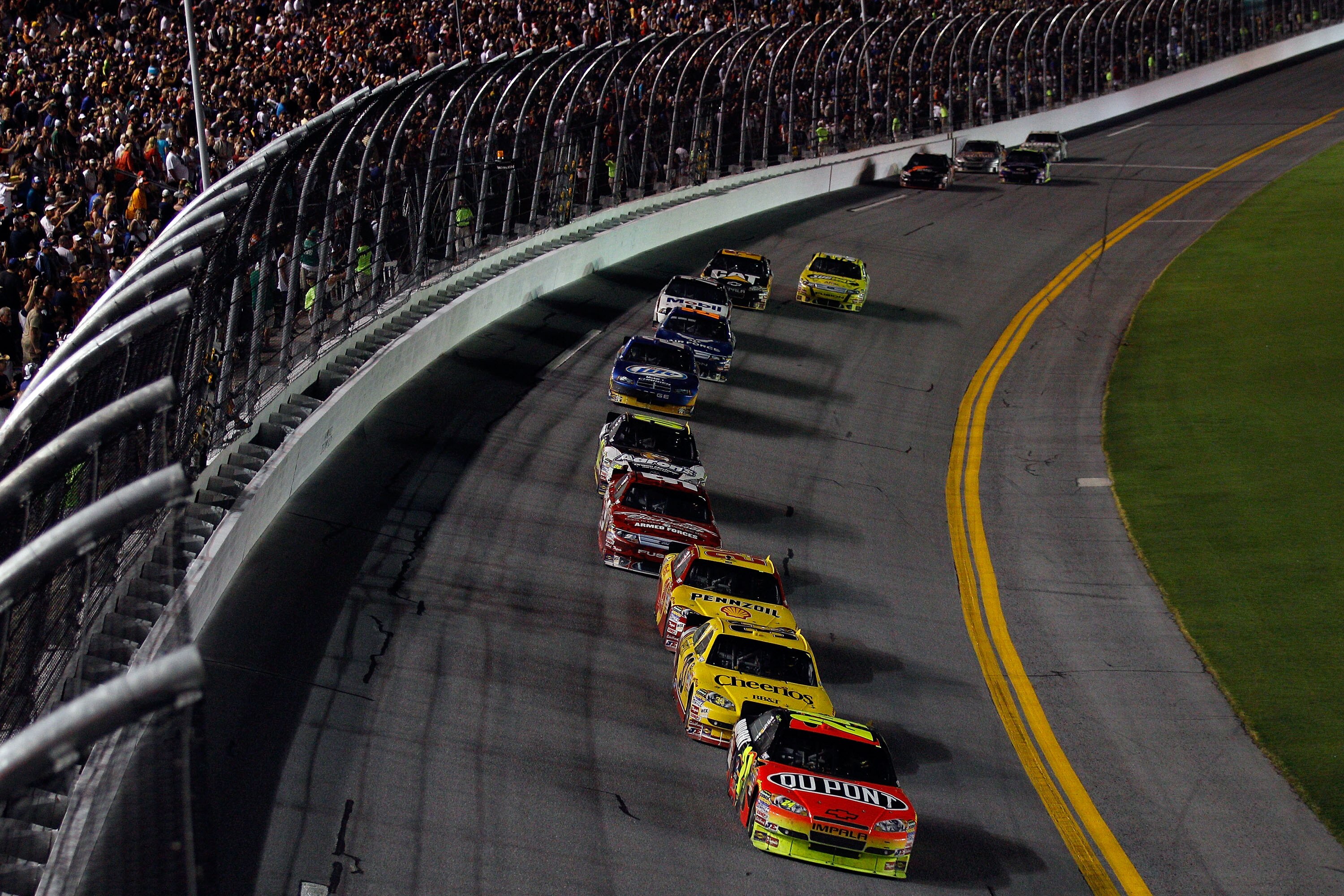 DAYTONA BEACH, FL - JULY 03:  Jeff Gordon, driver of the #24 DuPont Chevrolet, leads the field during the NASCAR Sprint Cup Series Coke Zero 400 at Daytona International Speedway on July 3, 2010 in Daytona Beach, Florida.  (Photo by Chris Graythen/Getty I