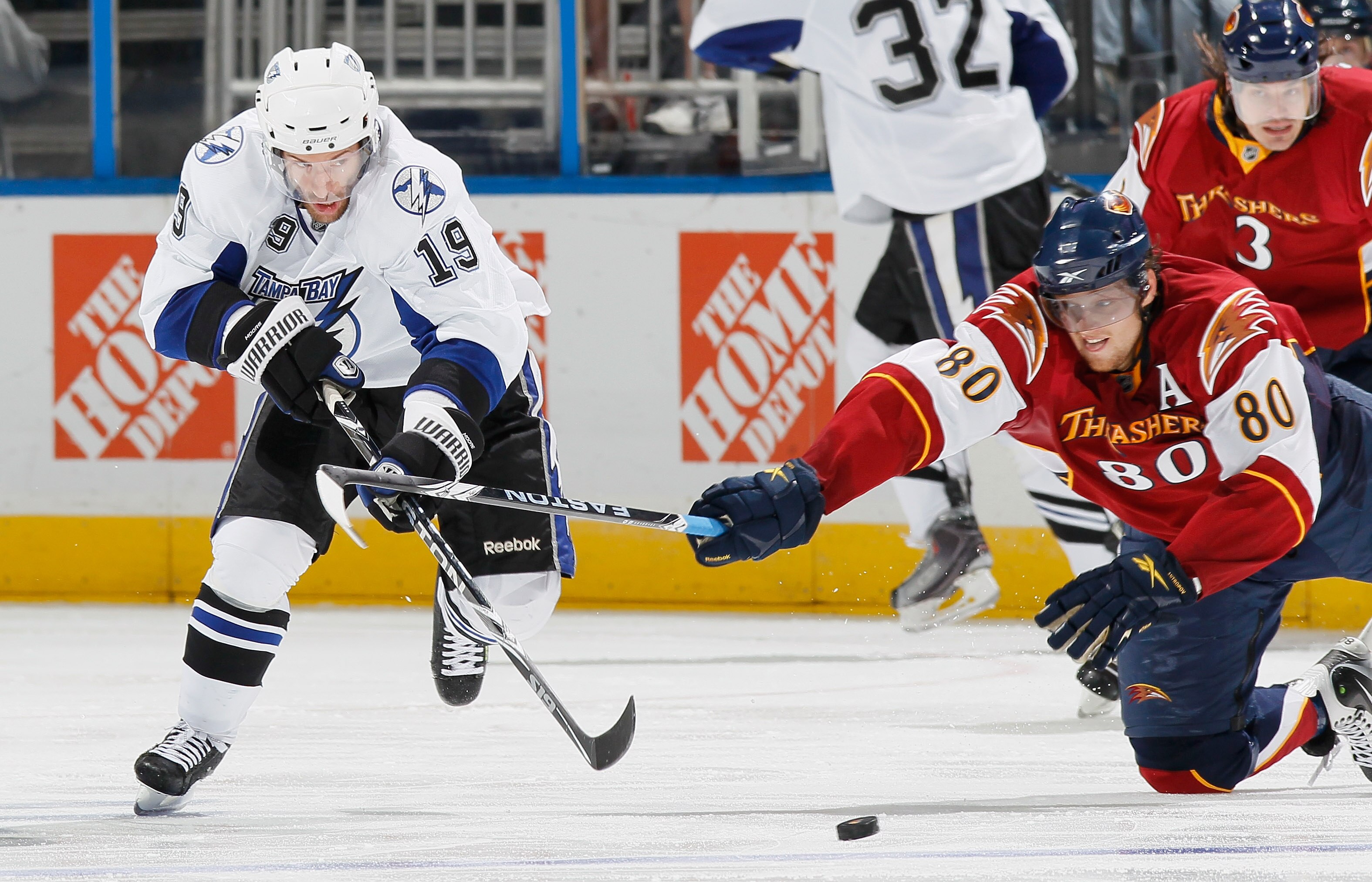ATLANTA - OCTOBER 22:  Dominic Moore #19 of the Tampa Bay Lightning battles for the puck against Nik Antropov #80 of the Atlanta Thrashers at Philips Arena on October 22, 2010 in Atlanta, Georgia.  (Photo by Kevin C. Cox/Getty Images)