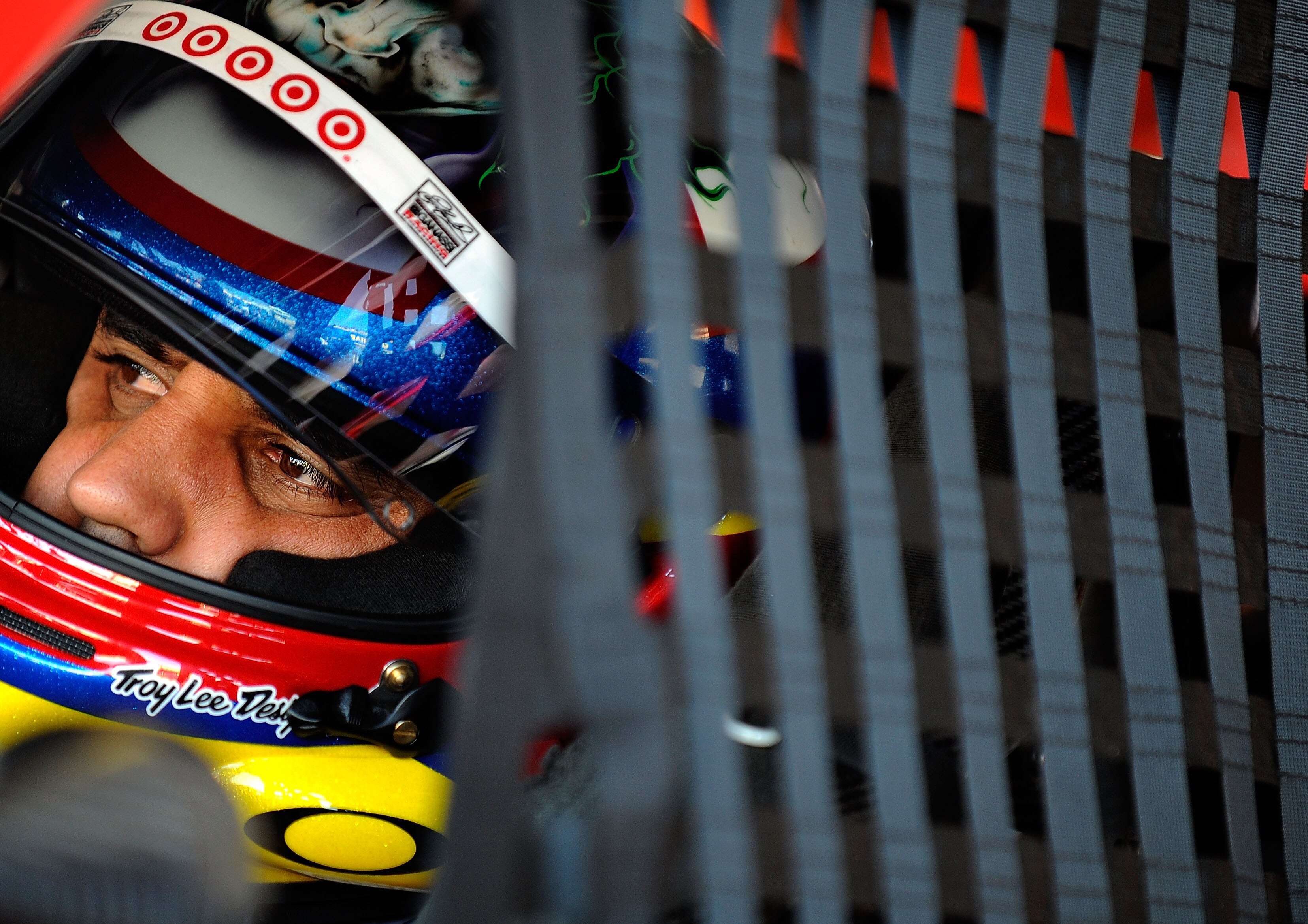 AVONDALE, AZ - NOVEMBER 13:  Juan Pablo Montoya, driver of the #42 Target Chevrolet, sits in his car during practice for the NASCAR Sprint Cup Series Kobalt Tools 500 at Phoenix International Raceway on November 13, 2010 in Avondale, Arizona.  (Photo by R