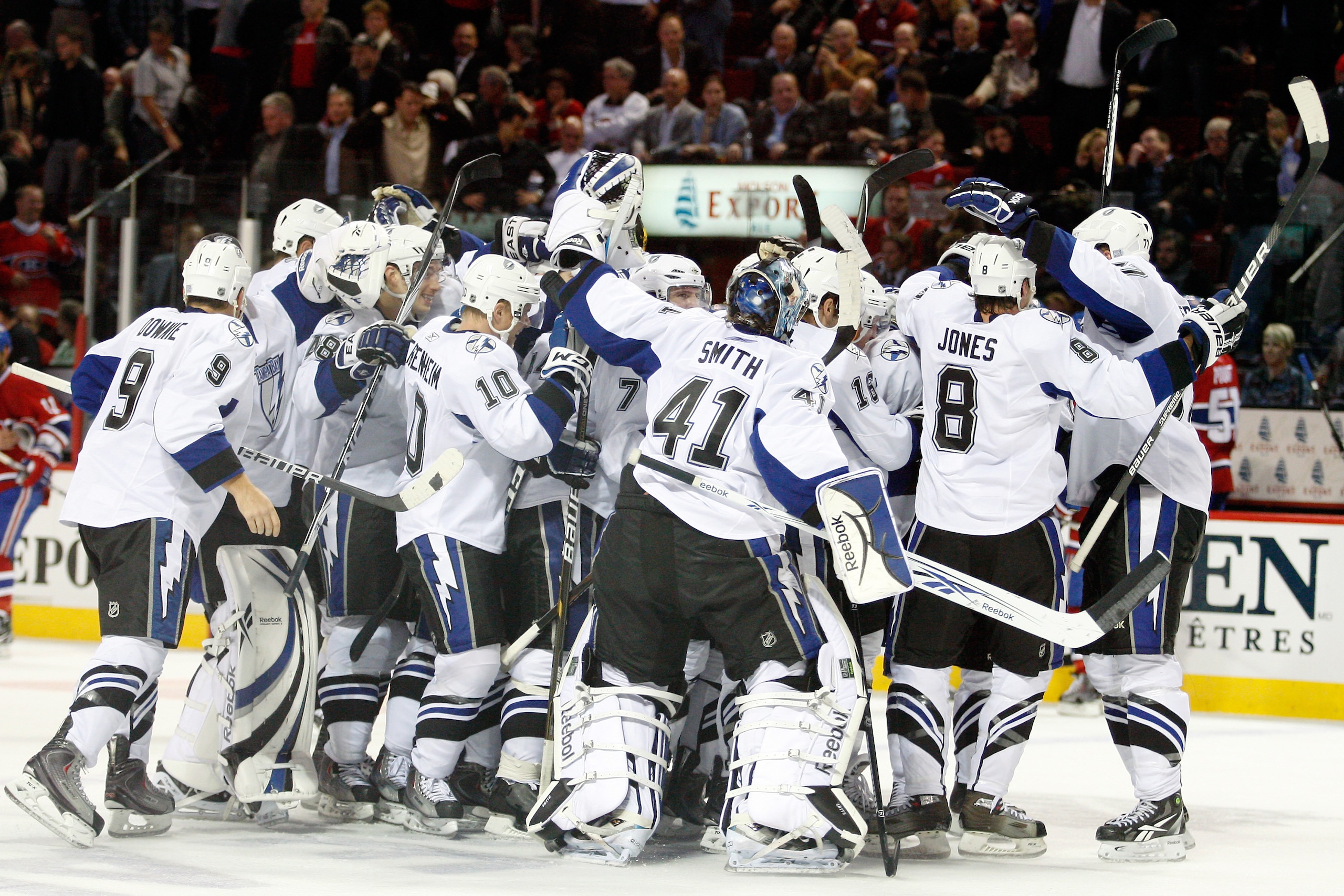 MONTREAL, CANADA - OCTOBER 13:  Members of the Tampa Bay Lightning celebrate the game winning goal by Ryan Malone #6 of the Tampa Bay Lightning during the NHL game against the Montreal Canadiens at the Bell Centre on October 13, 2010 in Montreal, Quebec,