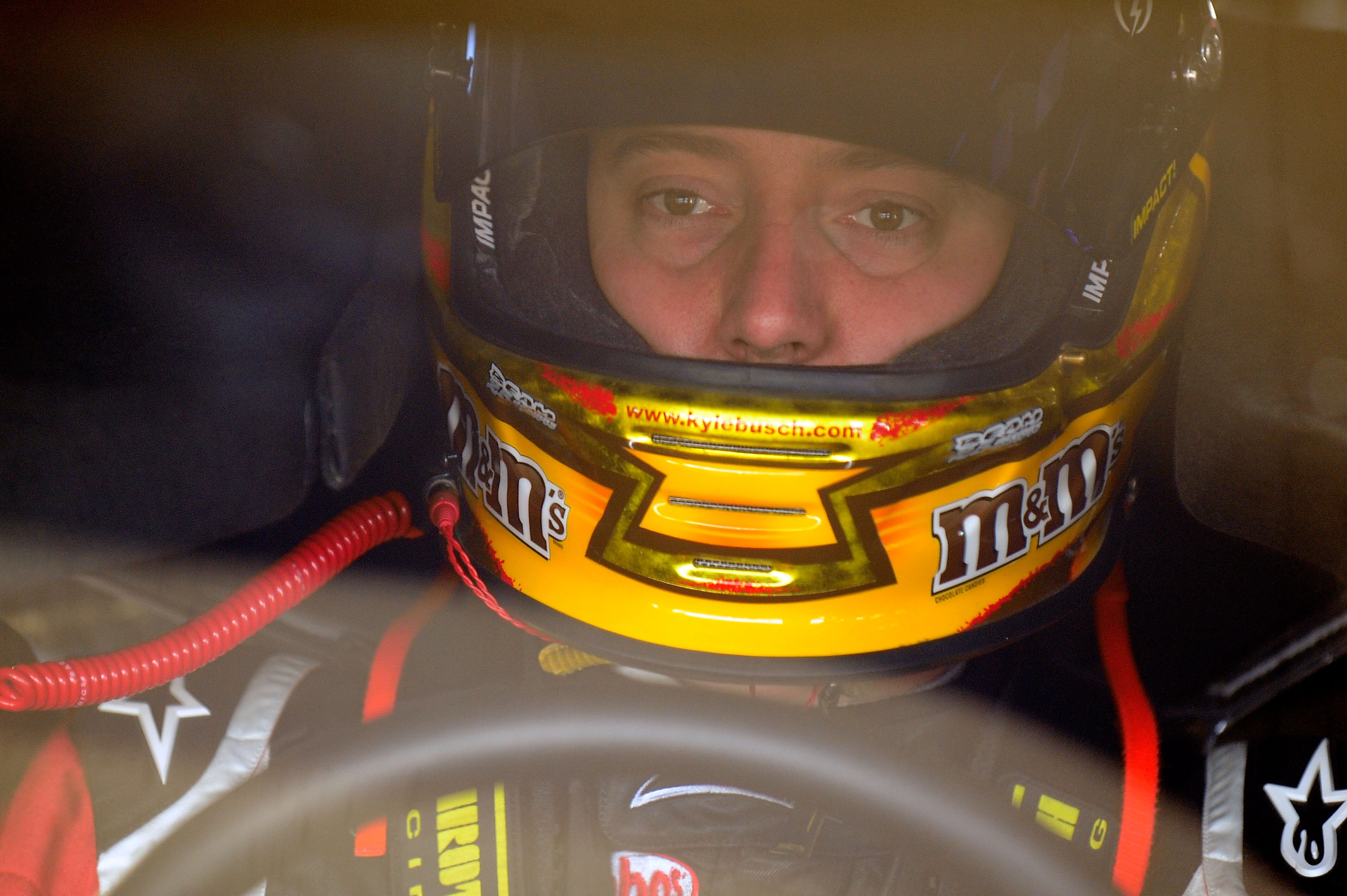 HOMESTEAD, FL - NOVEMBER 20:  Kyle Busch, driver of the #18 M&M's Toyota, sits in his car during practice for the NASCAR Sprint Cup Series Ford 400 at Homestead-Miami Speedway on November 20, 2010 in Homestead, Florida.  (Photo by Rusty Jarrett/Getty Imag