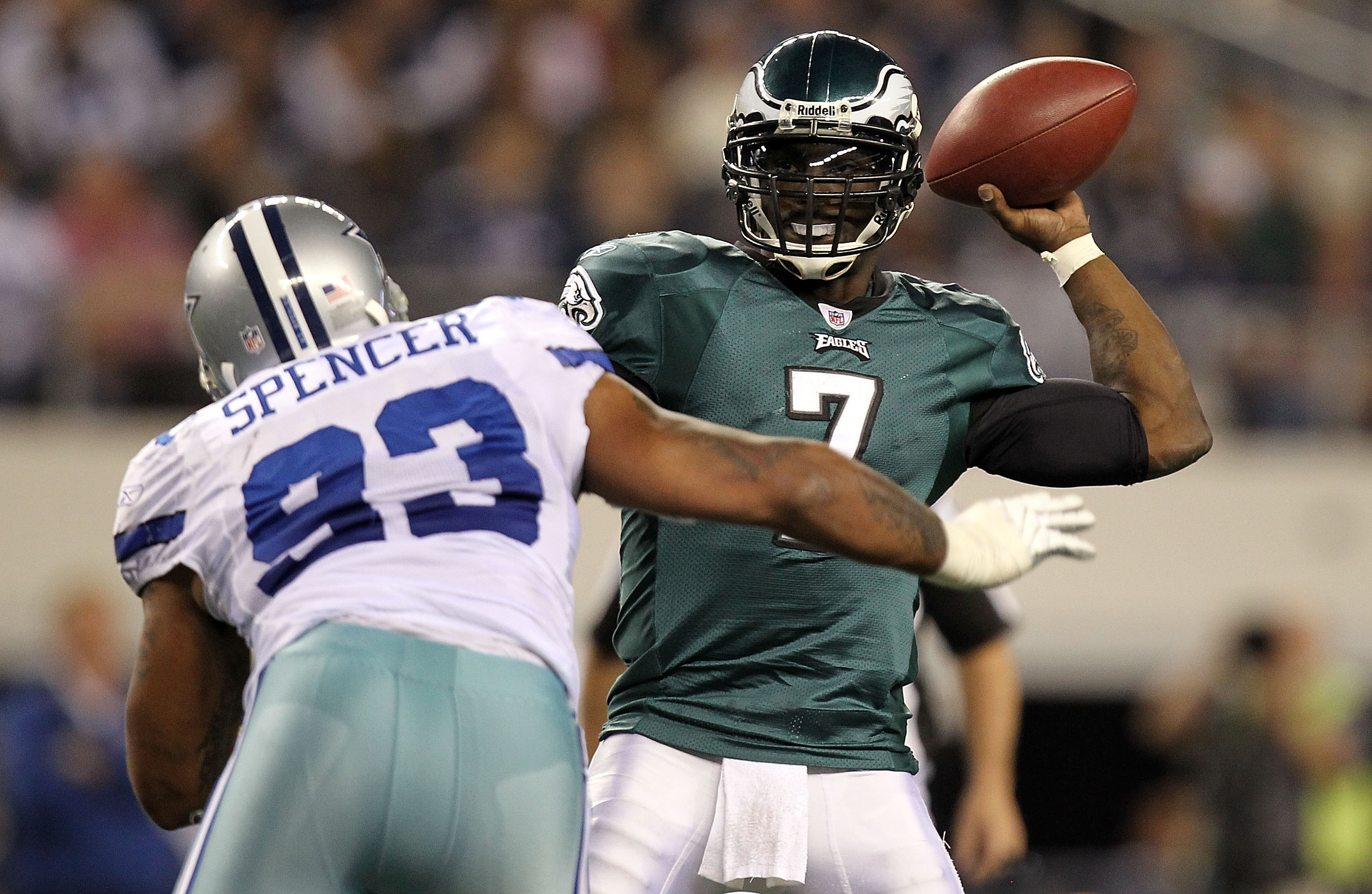 ARLINGTON, TX - DECEMBER 12:  Quarterback Michael Vick #7 of the Philadelphia Eagles drops back to pass against Anthony Spencer #93 of the Dallas Cowboys at Cowboys Stadium on December 12, 2010 in Arlington, Texas.  (Photo by Ronald Martinez/Getty Images)