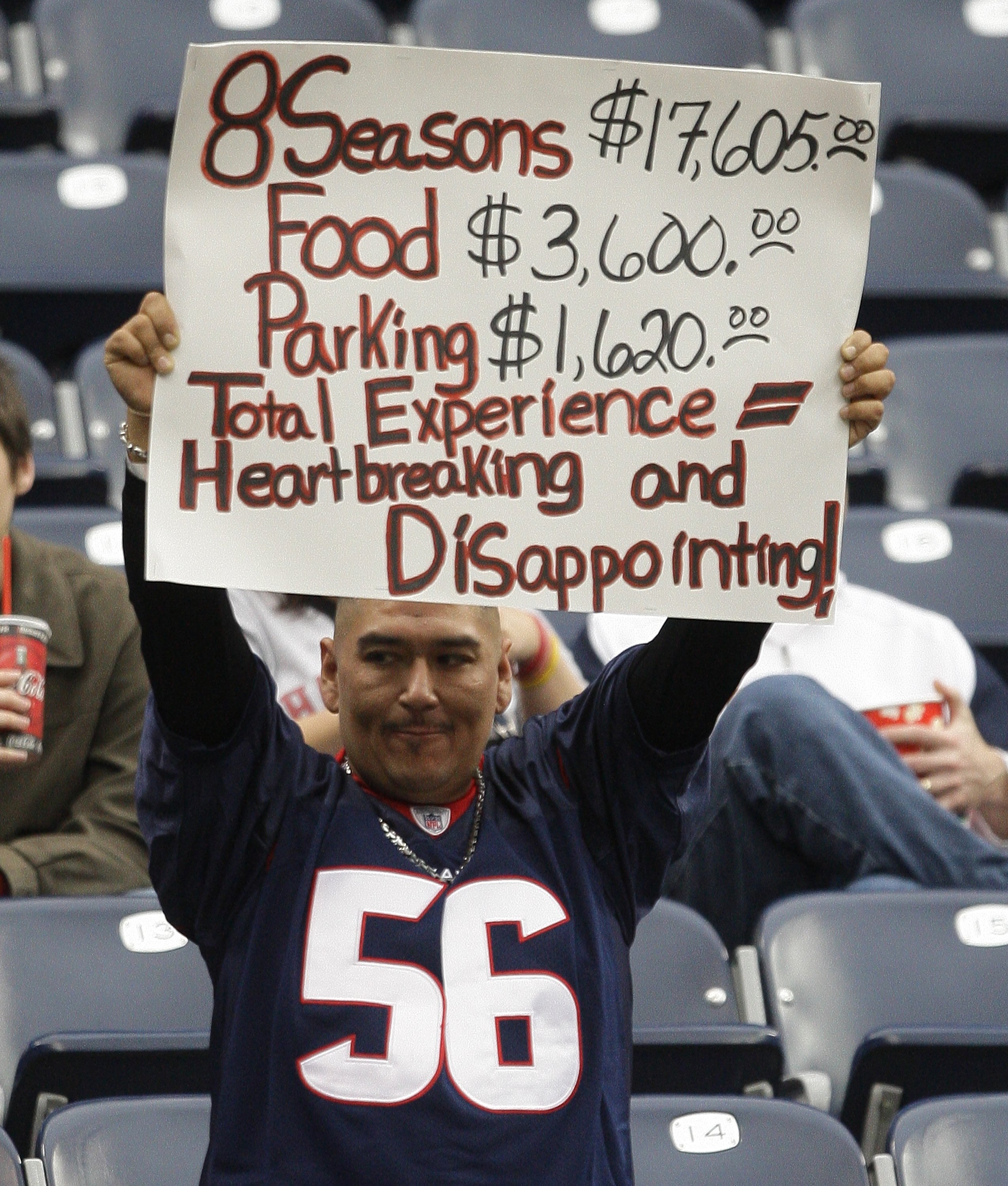 HOUSTON - DECEMBER 13:  A male fan holds up a sign to show his disappointment in the Texans' season during the game against the Seattle Seahawks at Reliant Stadium on December 13, 2009 in Houston, Texas.  (Photo by Bob Levey/Getty Images)