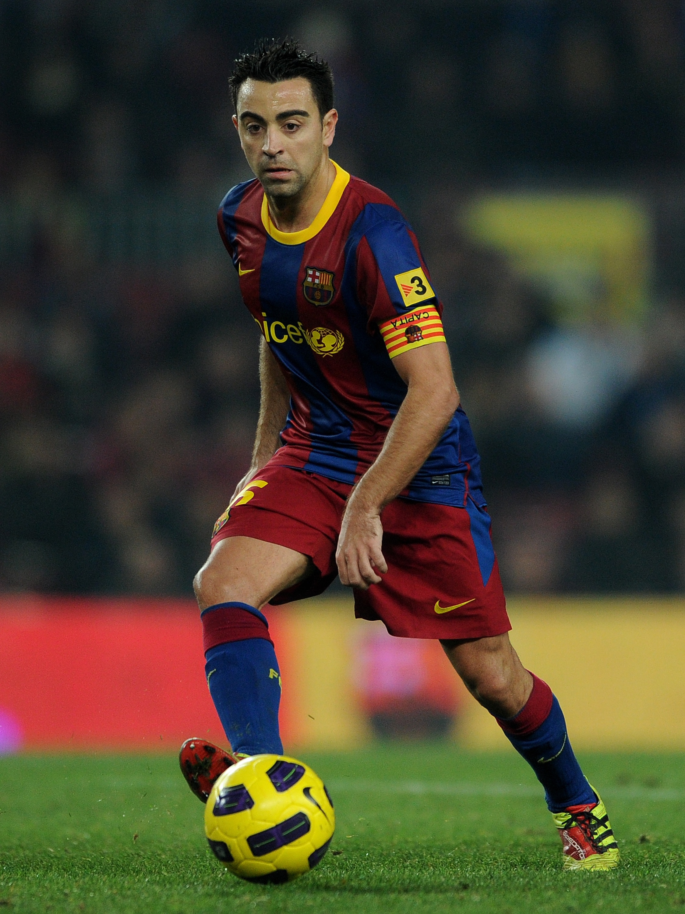 BARCELONA, SPAIN - DECEMBER 21:  Xavi Hernandez of Barcelona strikes the ball during the round of last 16 Copa del Rey match between FC Barcelona and Athletic Bilbao at the Camp Nou stadium on December 21, 2010 in Barcelona, Spain.  (Photo by Jasper Juine