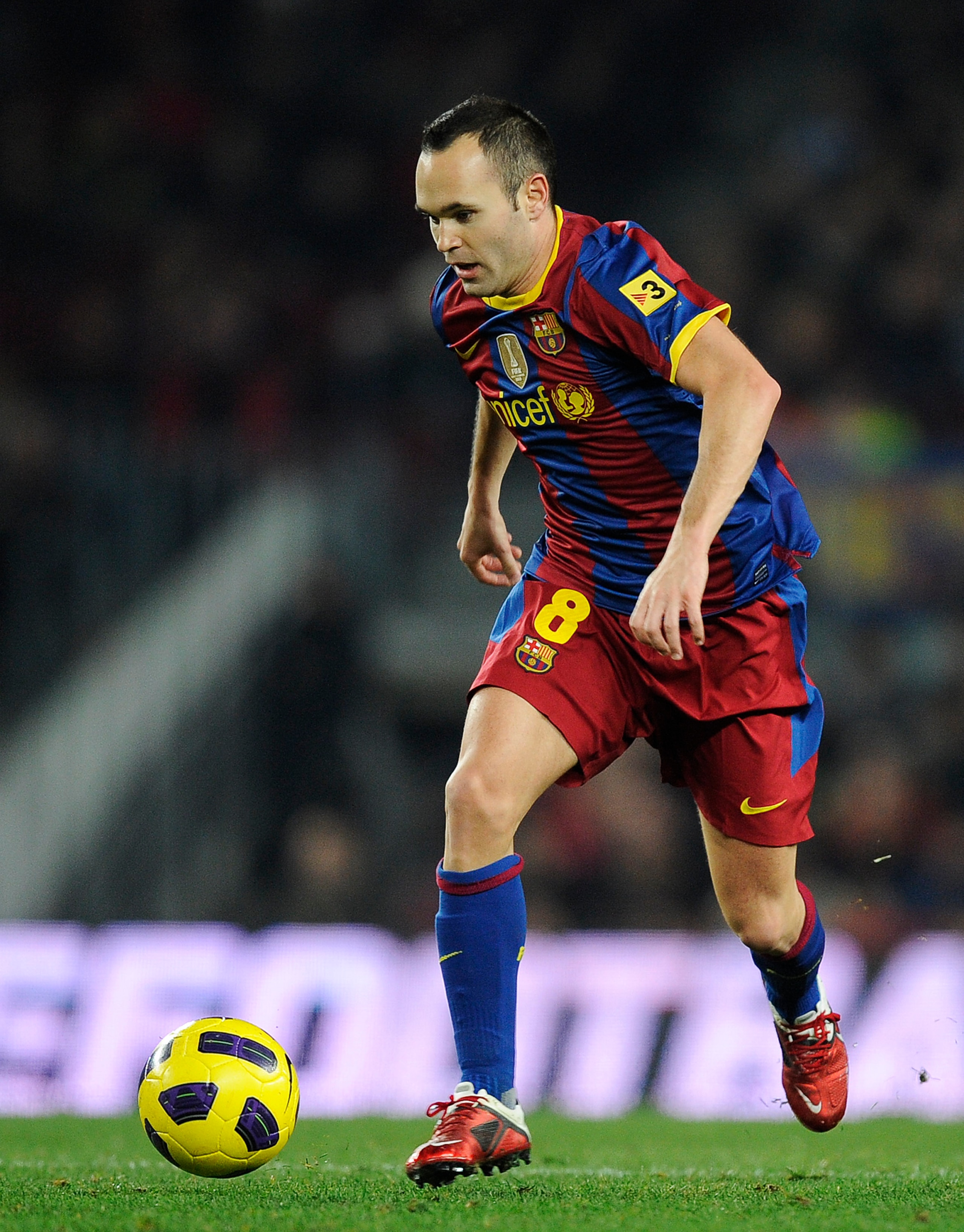 BARCELONA, SPAIN - DECEMBER 12:  Andres Iniesta of Barcelona runs with the ball during the La Liga match between Barcelona and Real Sociedad at Camp Nou Stadium on December 12, 2010 in Barcelona, Spain. Barcelona won 5-0.  (Photo by David Ramos/Getty Imag