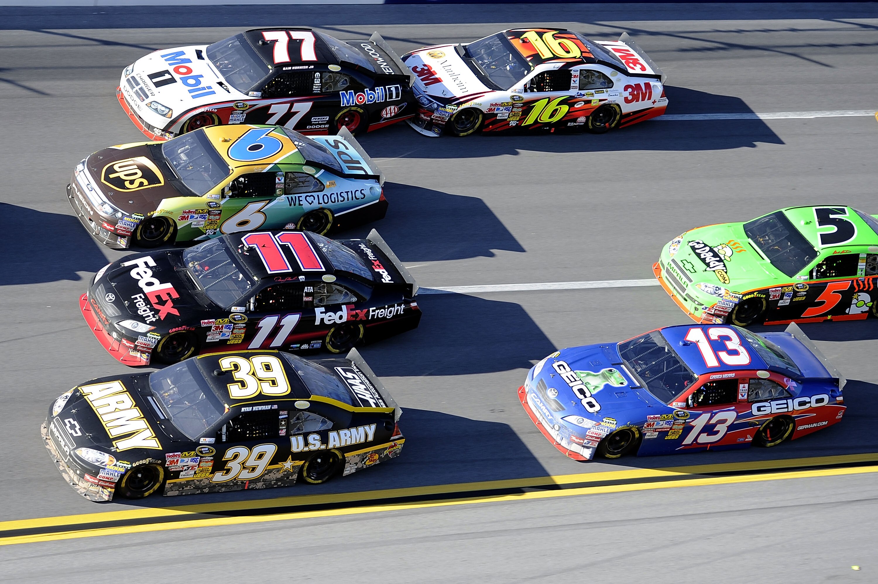 TALLADEGA, AL - OCTOBER 31:  Cars drive four lanes wide in turn three during the NASCAR Sprint Cup Series AMP Energy Juice 500 at Talladega Superspeedway on October 31, 2010 in Talladega, Alabama.  (Photo by John Harrelson/Getty Images for NASCAR)