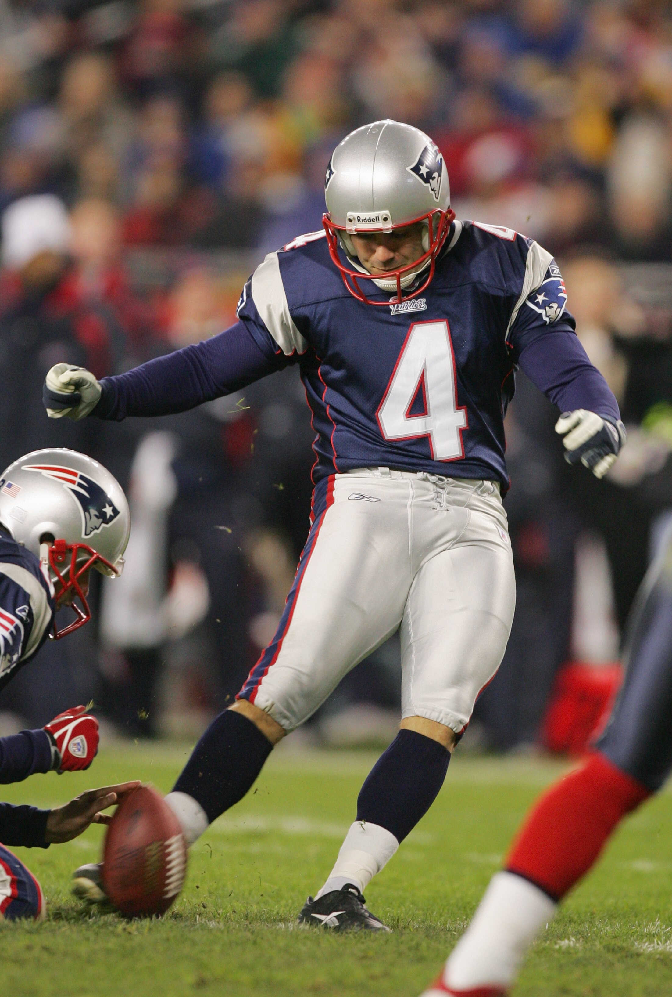 FOXBORO, MA - NOVEMBER 14:  Punter Josh Miller #8 of the New England Patriots holds the ball for kicker Adam Vinatieri #4 during the game against the Buffalo Bills at Gillette Stadium on November 14, 2004 in Foxboro, Massachusetts. The Patriots defeated t
