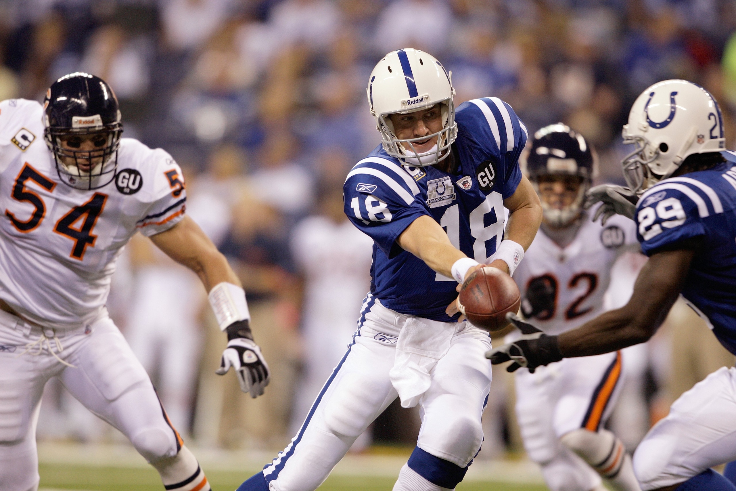 INDIANAPOLIS - SEPTEMBER 07:  Quarterback Peyton Manning #18 of the Indianapolis Colts hands off the ball during their NFL game against the Chicago Bears at Lucas Oil Stadium on September 7, 2008 in Indianapolis, Indiana. The Bears defeated the Colts 29-1