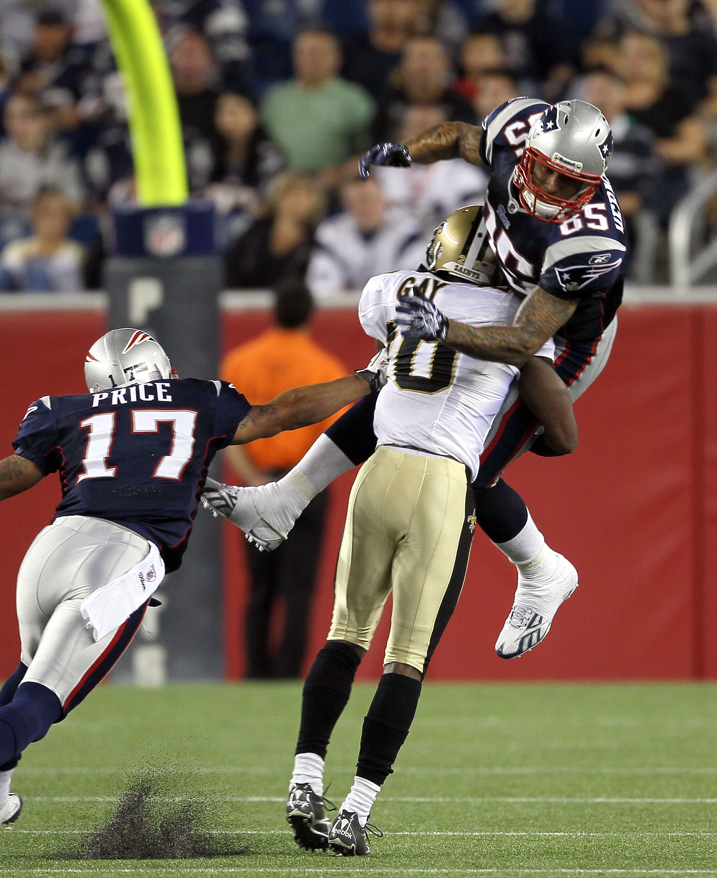 FOXBORO, MA - AUGUST 12: Randall Gay # 20 of the New Orleans Saints collides with Aaron Hernandez # 85 of the New England Patriots during the preseason game at Gillette Stadium on August 12, 2010 in Foxboro, Massachusetts. (Photo by Jim Rogash/Getty Image