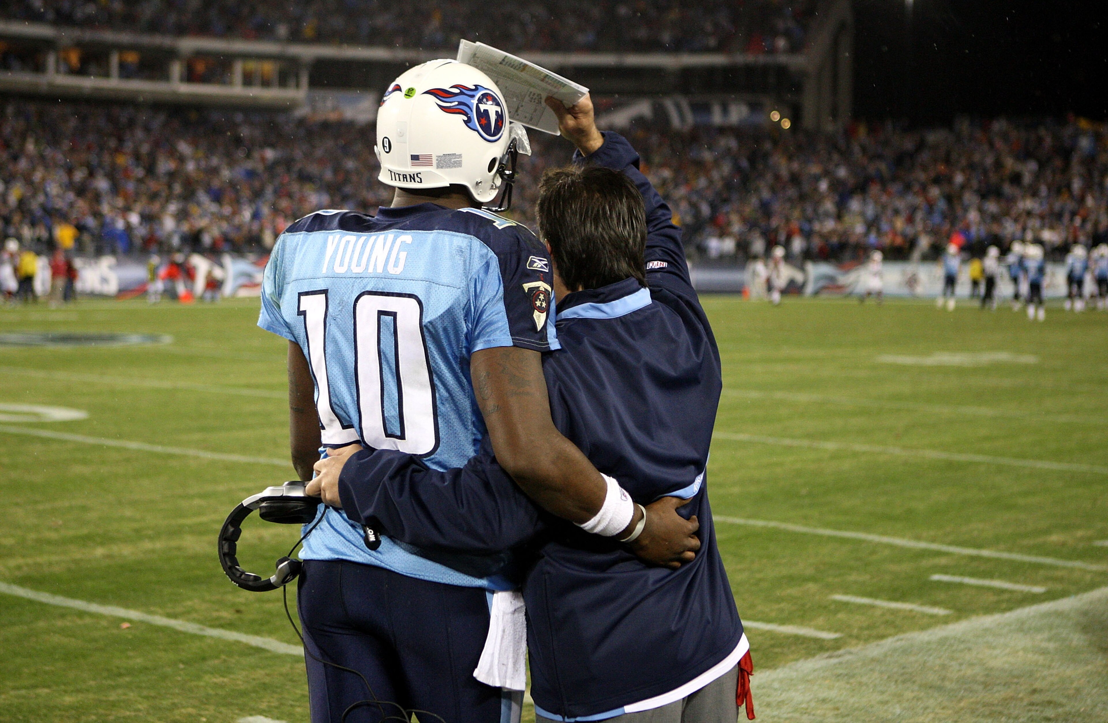 NASHVILLE, TN - NOVEMBER 29:  Vince Young #10 and head coach Jeff Fisher of the Tennessee Titans share a moment during their game against the Arizona Cardinals at LP Field on November 29, 2009 in Nashville, Tennessee.  (Photo by Streeter Lecka/Getty Image
