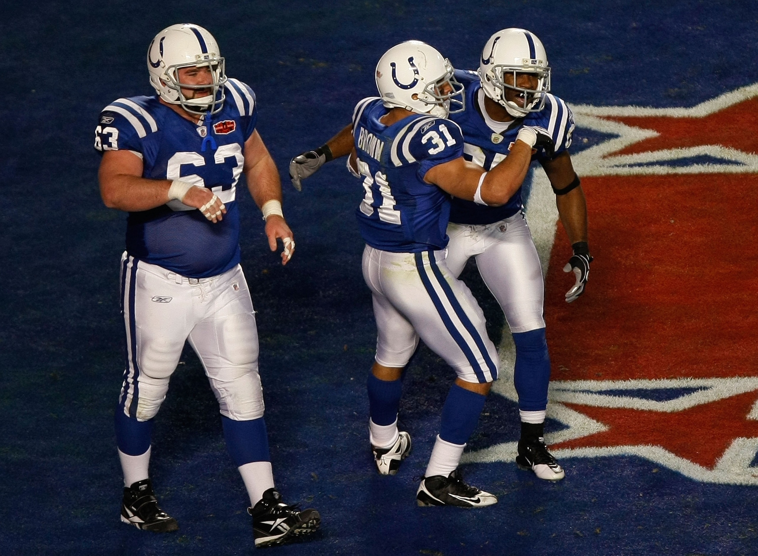MIAMI GARDENS, FL - FEBRUARY 07: Jeff Saturday #63, Donald Brown #31 and Pierre Garcon #85 of the Indianapolis Colts celebrate after a touchdown in the first quarter against the New Orleans Saints during Super Bowl XLIV on February 7, 2010 at Sun Life Sta MIAMI GARDENS, FL - FEBRUARY 07: Jeff Saturday #63, Donald Brown #31 and Pierre Garcon #85 of the Indianapolis Colts celebrate after a touchdown in the first quarter against the New Orleans Saints during Super Bowl XLIV on February 7, 2010 at Sun Life Sta