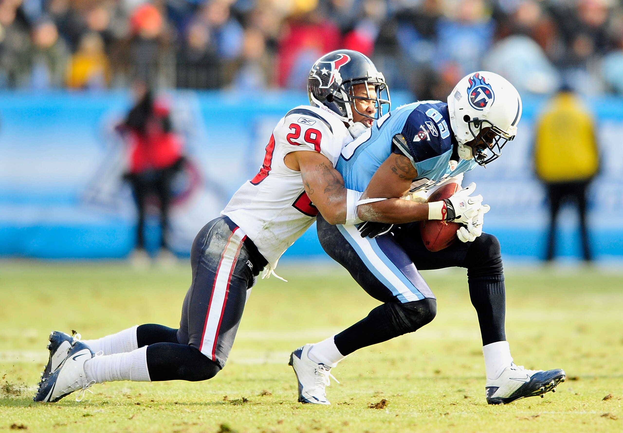 NASHVILLE, TN - DECEMBER 19: Nate Washington #85 of the Tennessee Titans makes a catch under pressure from Glover Quin #29 of the Houston Texans at LP Field on December 19, 2010 in Nashville, Tennessee. The Titans defeated the Texans, 31-17. (Photo by G NASHVILLE, TN - DECEMBER 19: Nate Washington #85 of the Tennessee Titans makes a catch under pressure from Glover Quin #29 of the Houston Texans at LP Field on December 19, 2010 in Nashville, Tennessee. The Titans defeated the Texans, 31-17. (Photo by G