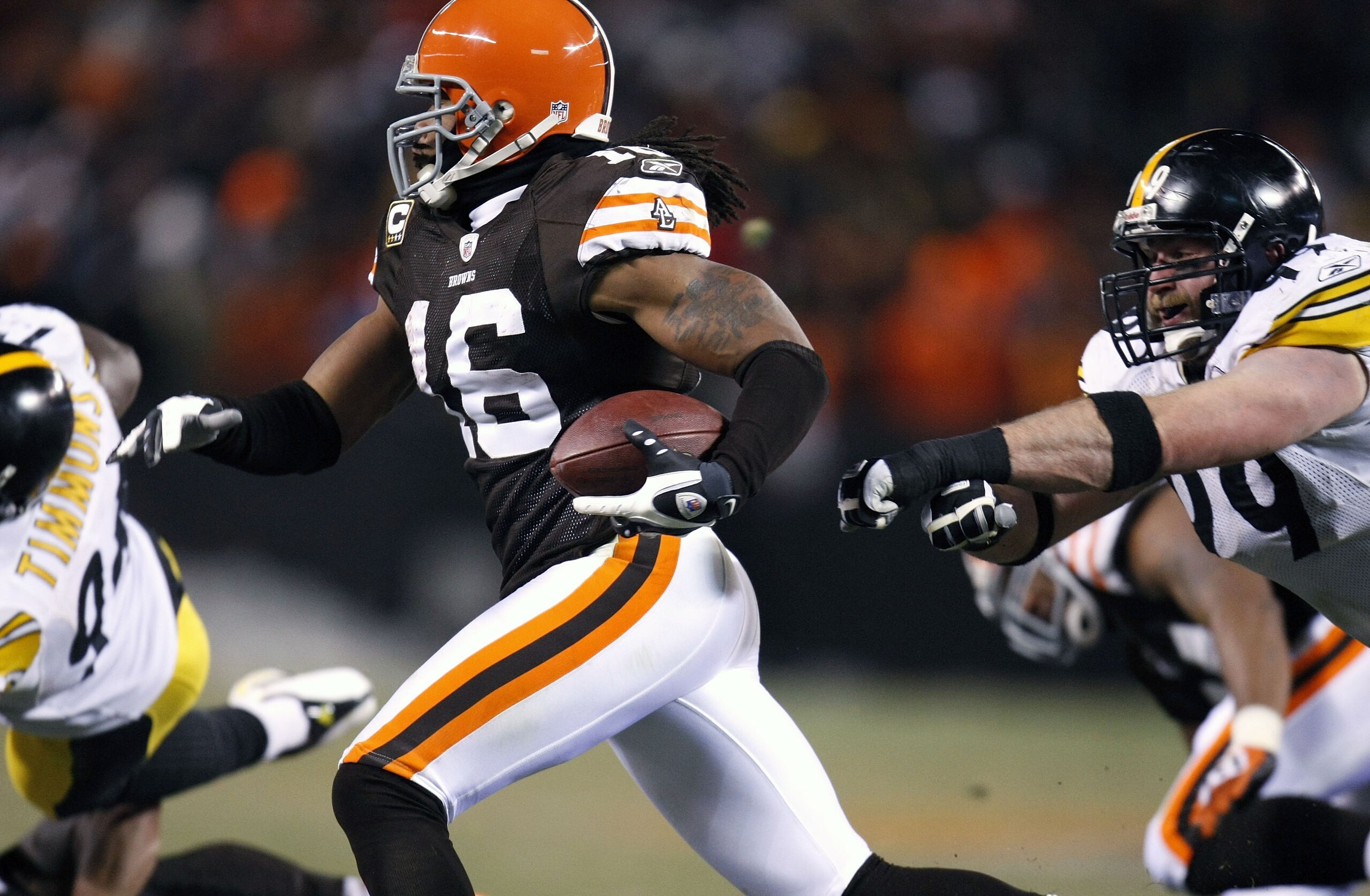 CLEVELAND - DECEMBER 10: Joshua Cribbs #16 of the Cleveland Browns runs past the grasp of Brett Keisel #99 of the Pittsburgh Steelers on December 10, 2009 at Cleveland Browns Stadium in Cleveland, Ohio. Cleveland won the game 13-6. (Photo by Gregory Shamu