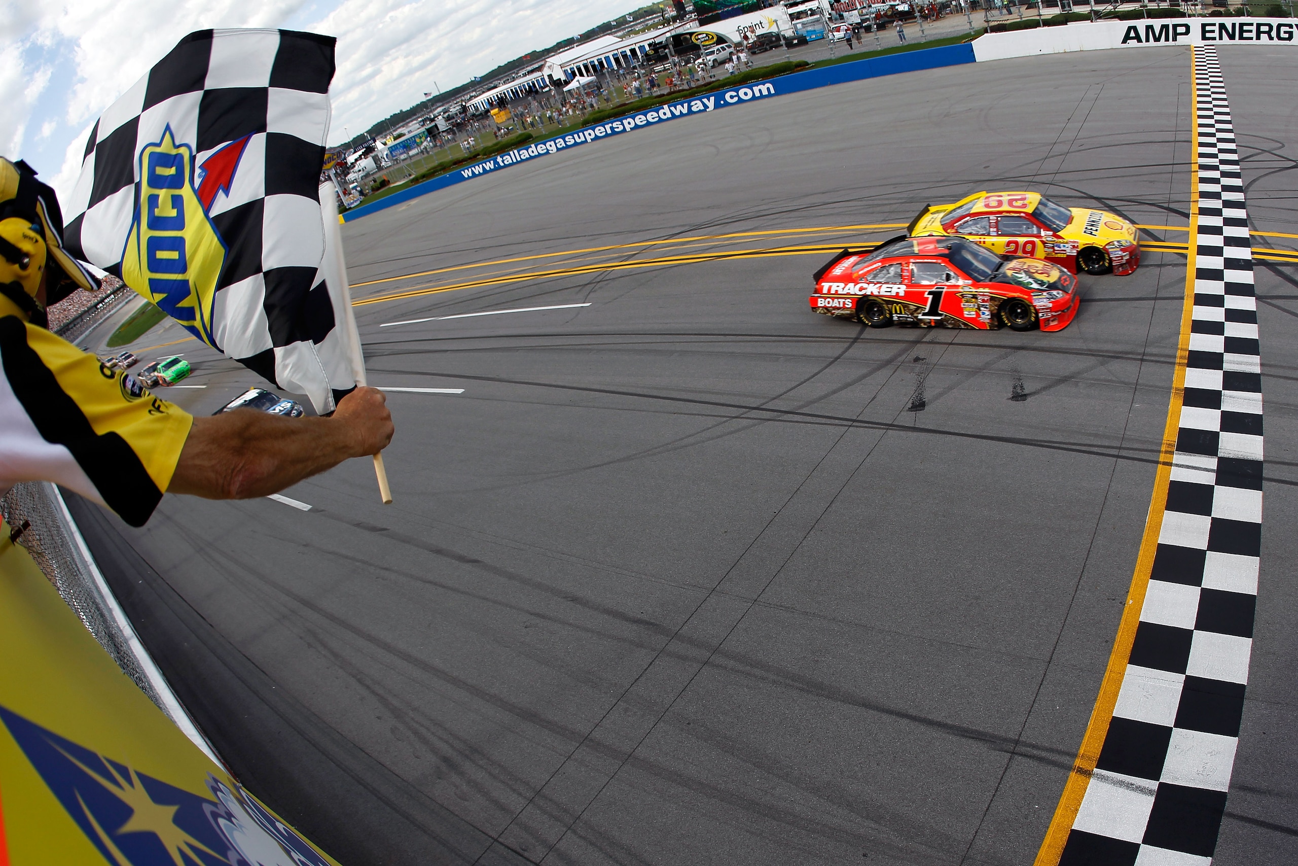 TALLADEGA, AL - APRIL 25: Kevin Harvick, driver of the #29 Shell/Pennzoil Chevrolet, crosses the finish line ahead of Jamie McMurray, driver of the #1 Bass Pro Shops Chevrolet, to win the NASCAR Sprint Cup Series Aaron's 499 at Talladega Superspeedway on TALLADEGA, AL - APRIL 25: Kevin Harvick, driver of the #29 Shell/Pennzoil Chevrolet, crosses the finish line ahead of Jamie McMurray, driver of the #1 Bass Pro Shops Chevrolet, to win the NASCAR Sprint Cup Series Aaron's 499 at Talladega Superspeedway on