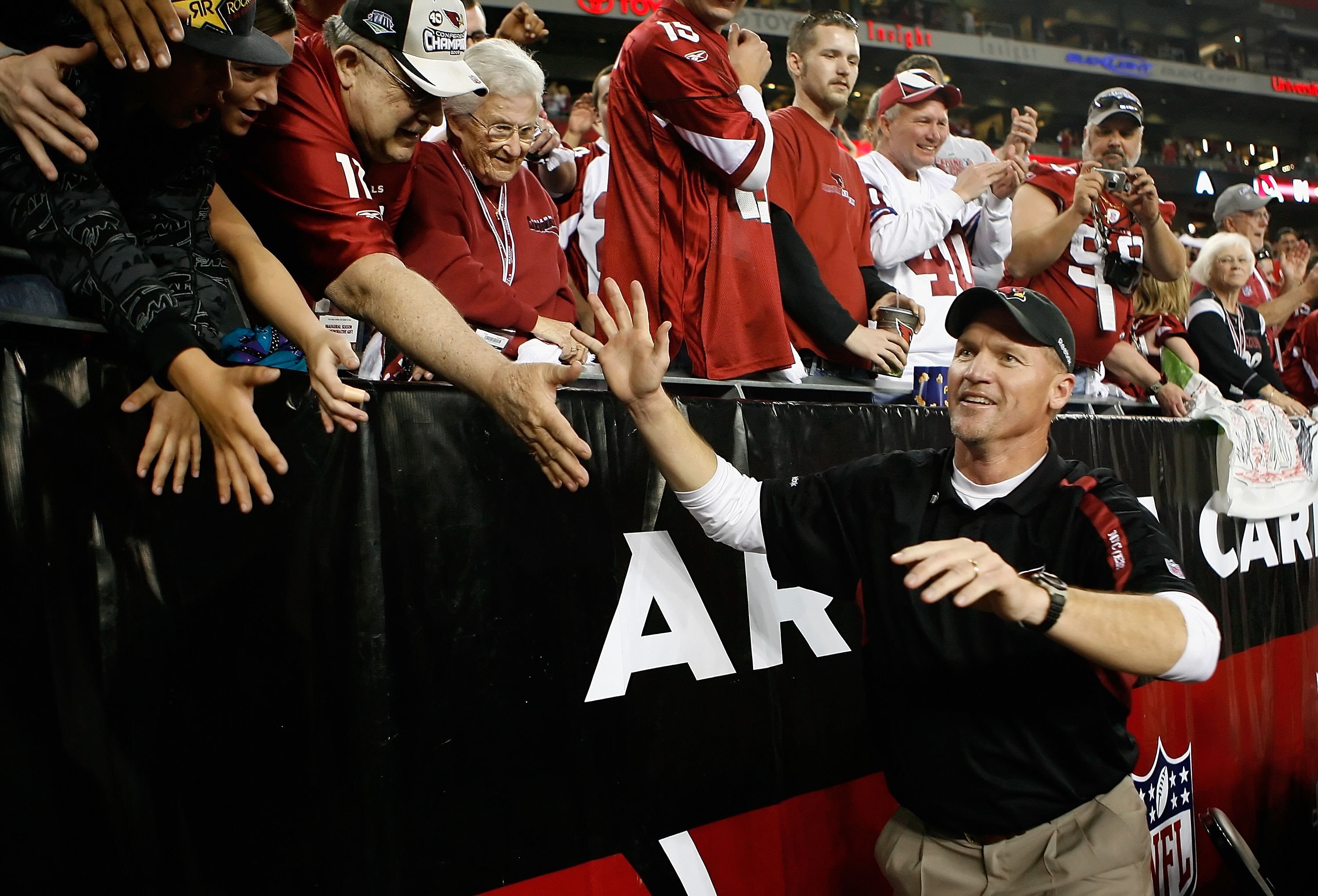 GLENDALE, AZ - JANUARY 10:  Head coach Ken Whisenhunt of the Arizona Cardinals celebrates after his team won the 2010 NFC wild-card playoff game 51-45 against the Green Bay Packers in overtime at University of Phoenix Stadium on January 10, 2010 in Glenda