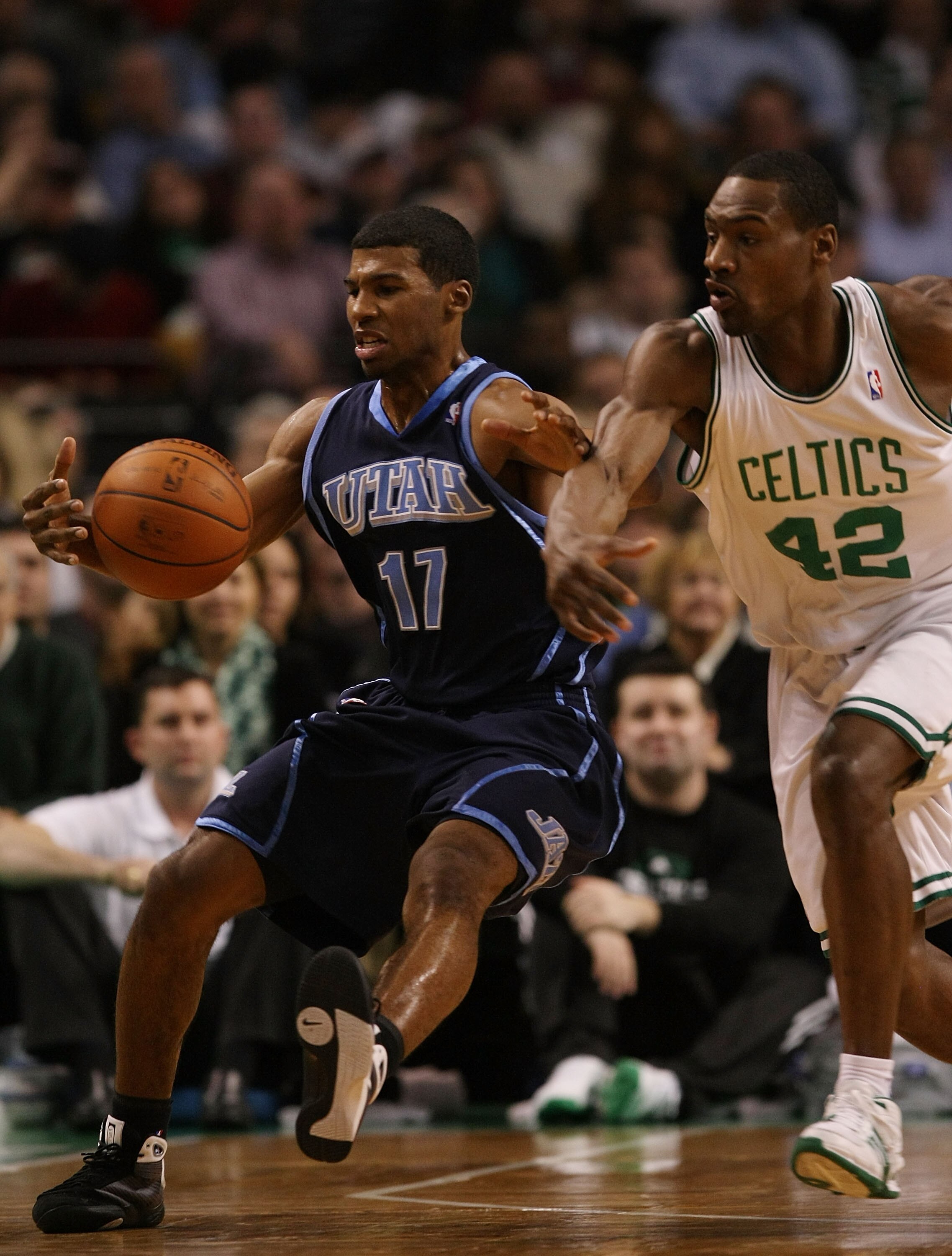 BOSTON - DECEMBER 15:  Ronnie Price #17 of the Utah Jazz tries to maintain control of the ball as Tony Allen #42 of the Boston Celtics tries to steal on December 15, 2008 at TD Banknorth Garden in Boston, Massachusetts. The Celtics defeated the Jazz 100-9