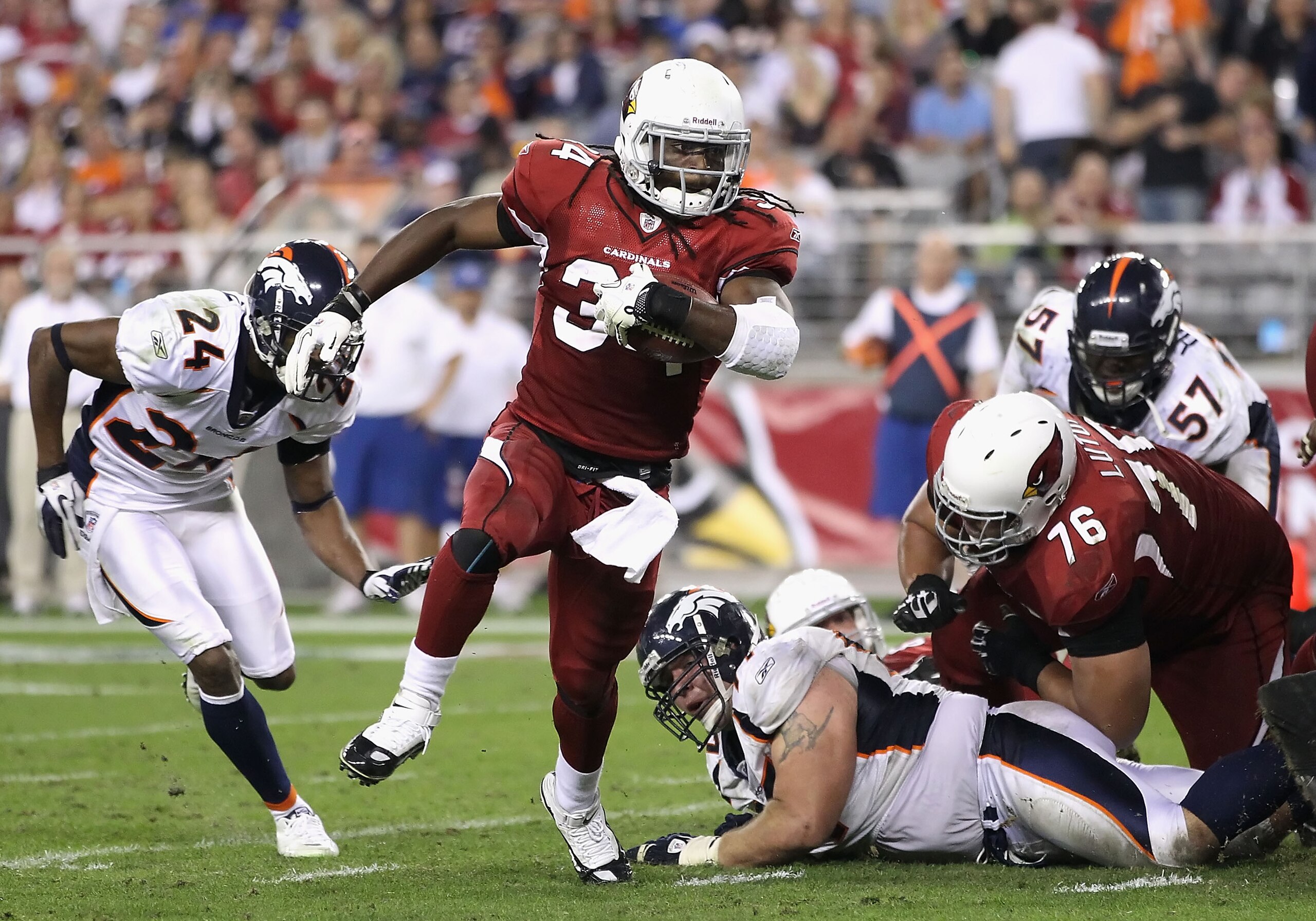 GLENDALE, AZ - DECEMBER 12:  Runningback Tim Hightower #34 of the Arizona Cardinals rushes the football against the Denver Broncos during the NFL game at the University of Phoenix Stadium on December 12, 2010 in Glendale, Arizona.  (Photo by Christian Pet