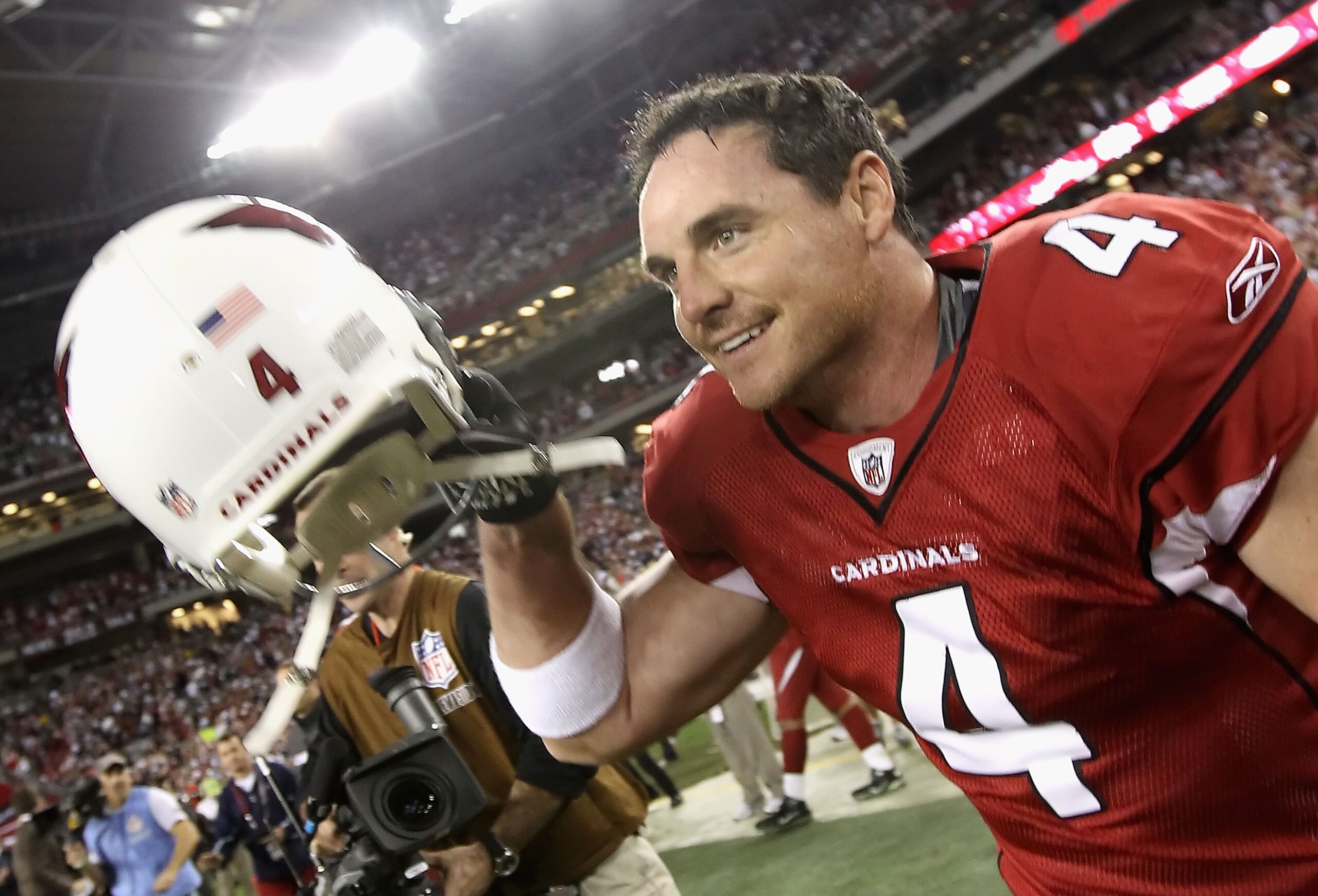 GLENDALE, AZ - DECEMBER 25:  Kicker Jay Feely #4 of the Arizona Cardinals runs out onto the field following the NFL game against the Dallas Cowboys at the University of Phoenix Stadium on December 25, 2010 in Glendale, Arizona. The Cardinals defeated the 