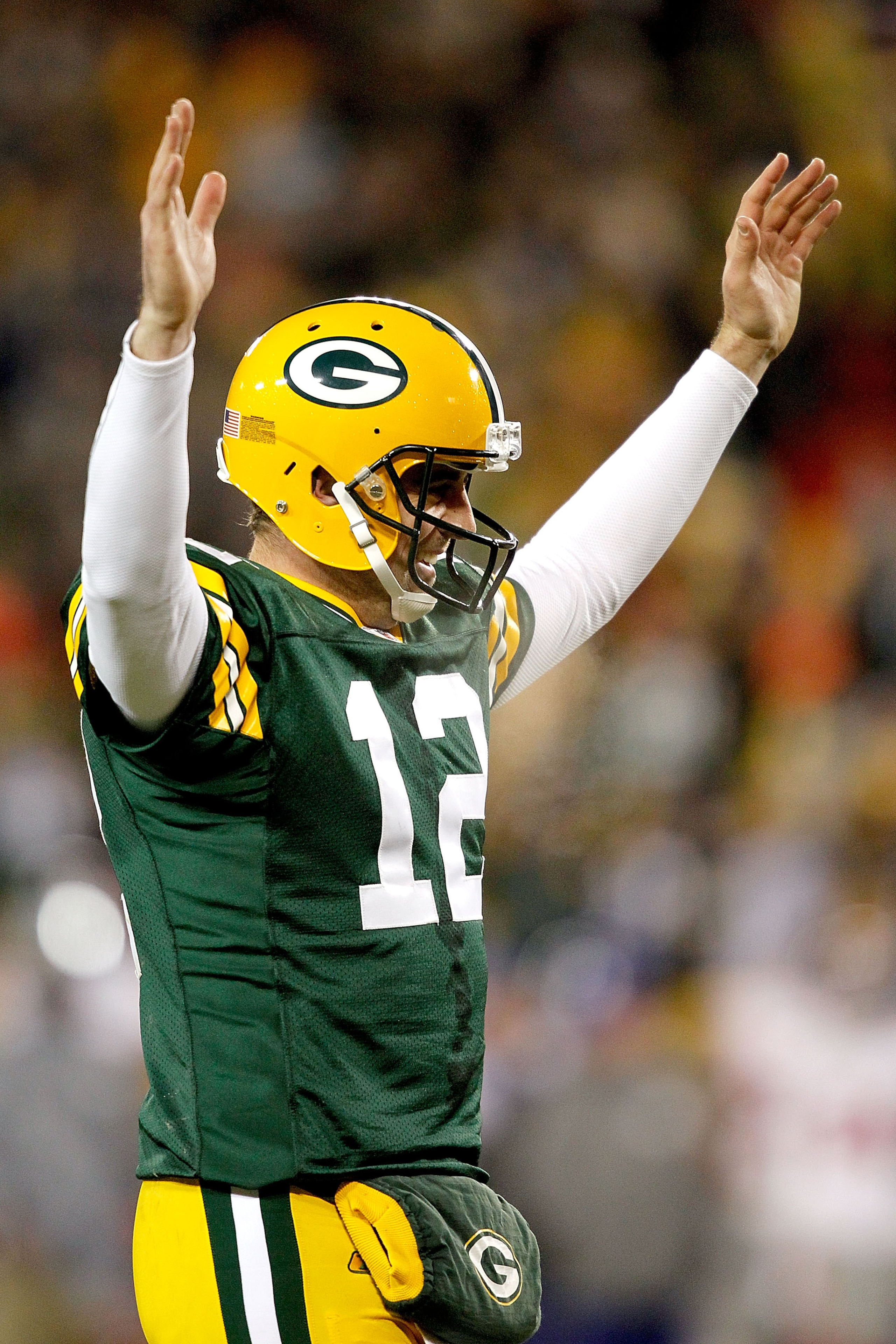 GREEN BAY, WI - DECEMBER 26:  Aaron Rodgers #12 of the Green Bay Packers is celebrates a touchdown against the New York Giants at Lambeau Field on December 26, 2010 in Green Bay, Wisconsin.  (Photo by Matthew Stockman/Getty Images)