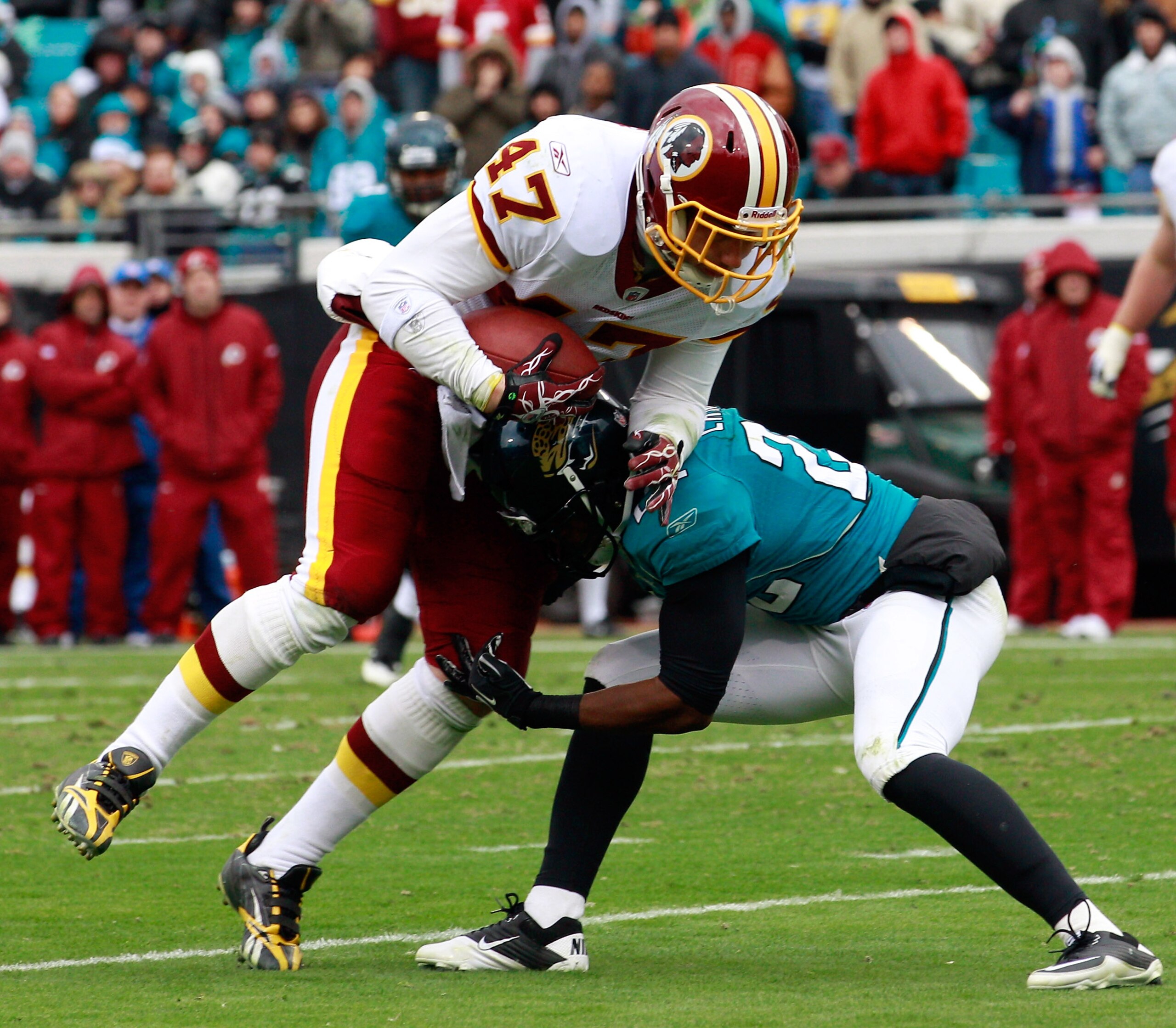 JACKSONVILLE, FL - DECEMBER 26: Chris Cooley #47 of the Washington Redskins is tackled by Don Carey #22 of the Jacksonville Jaguars during the game at EverBank Field on December 26, 2010 in Jacksonville, Florida. (Photo by Sam Greenwood/Getty Images) JACKSONVILLE, FL - DECEMBER 26: Chris Cooley #47 of the Washington Redskins is tackled by Don Carey #22 of the Jacksonville Jaguars during the game at EverBank Field on December 26, 2010 in Jacksonville, Florida. (Photo by Sam Greenwood/Getty Images)