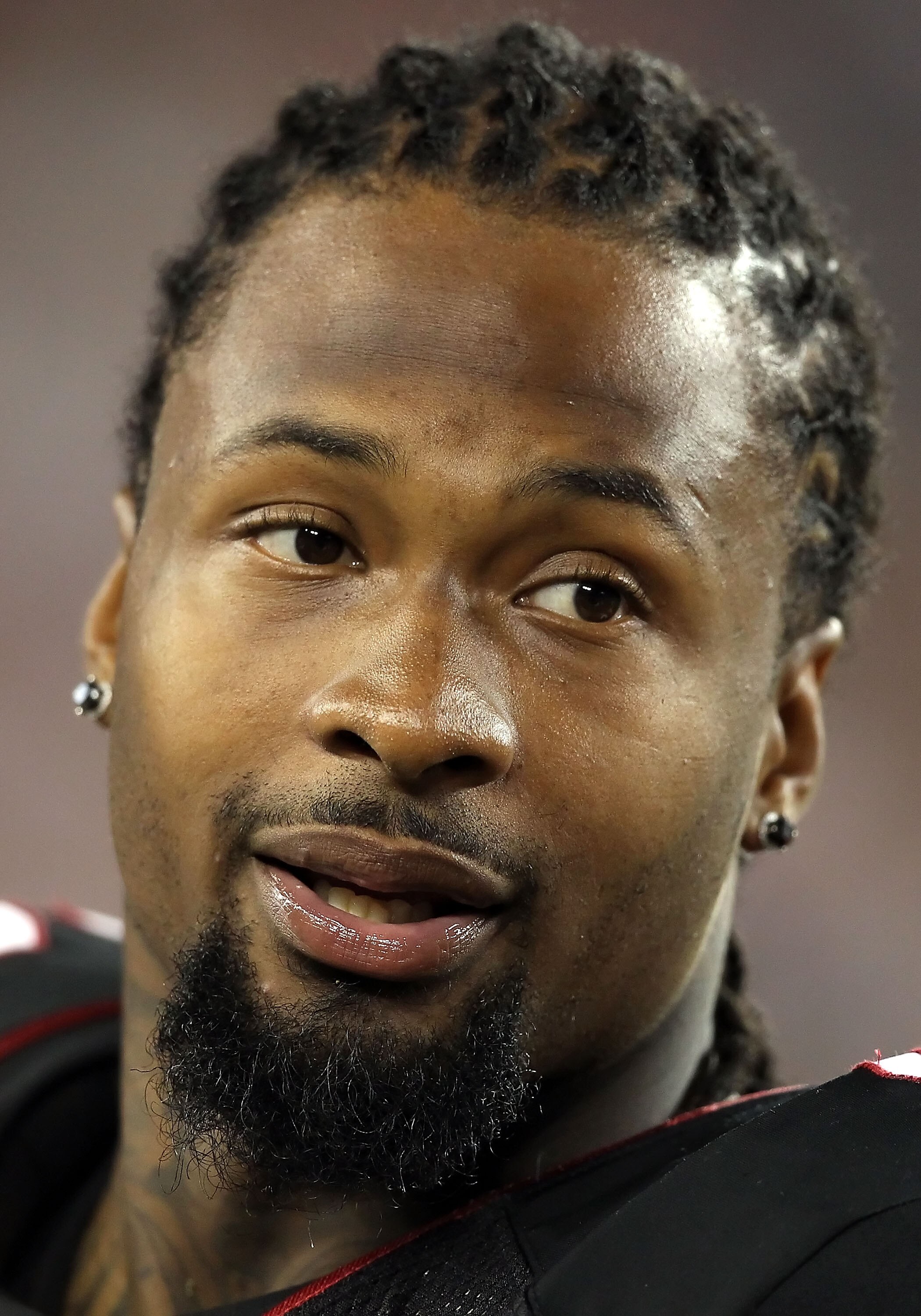 GLENDALE, AZ - SEPTEMBER 02:  Defensive tackle Darnell Dockett #90 of the Arizona Cardinals stands on the sidelines during the preseason NFL game against the Washington Redskins at the University of Phoenix Stadium on September 2, 2010 in Glendale, Arizon