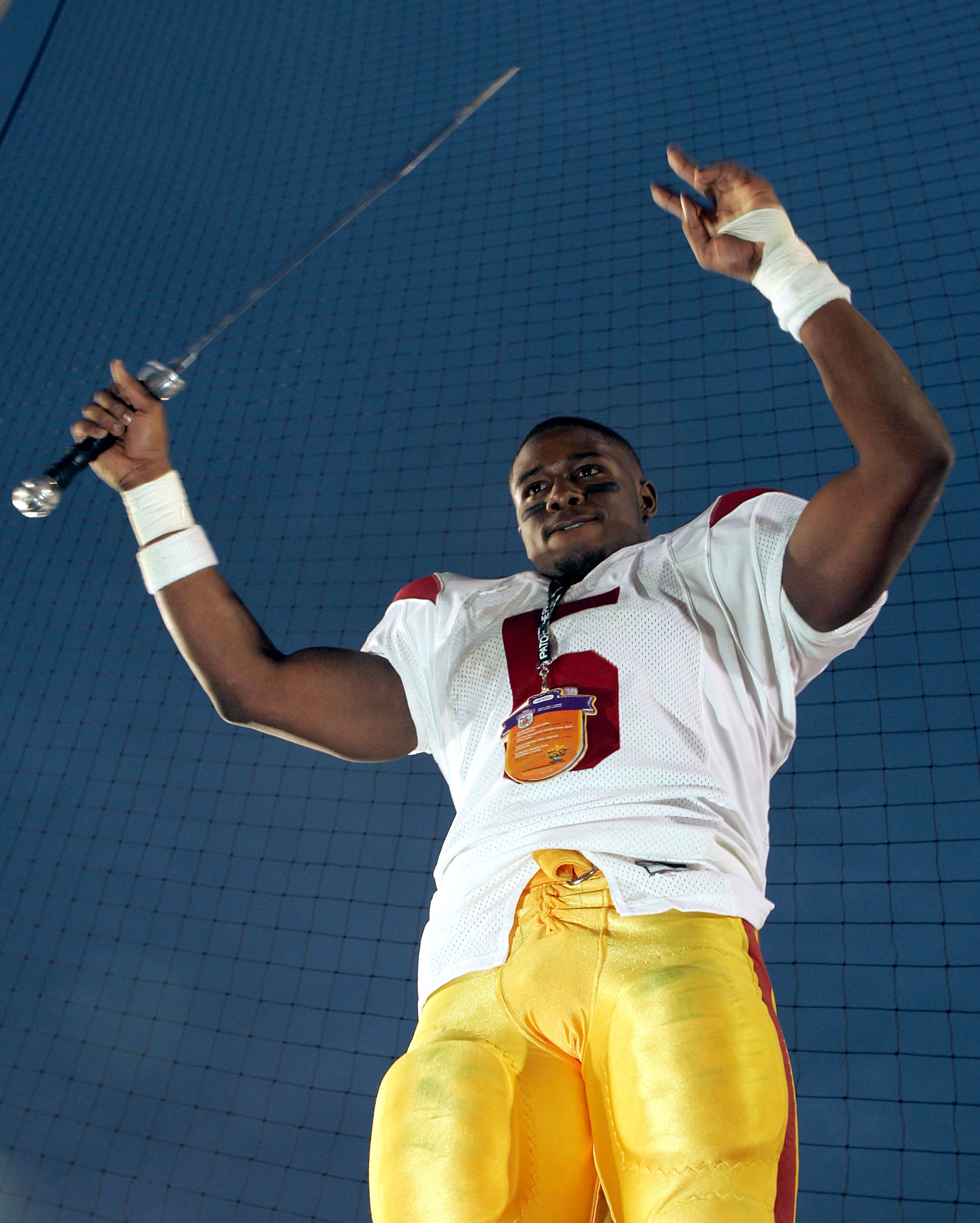 PASADENA, CA - DECEMBER 4:  Running back Reggie Bush #5 of the USC Trojans celebrates the team's 29-24 victory over the UCLA Bruins on December 4, 2004 at the Rose Bowl in Pasadena, California (Photo by Jeff Gross/Getty Images)