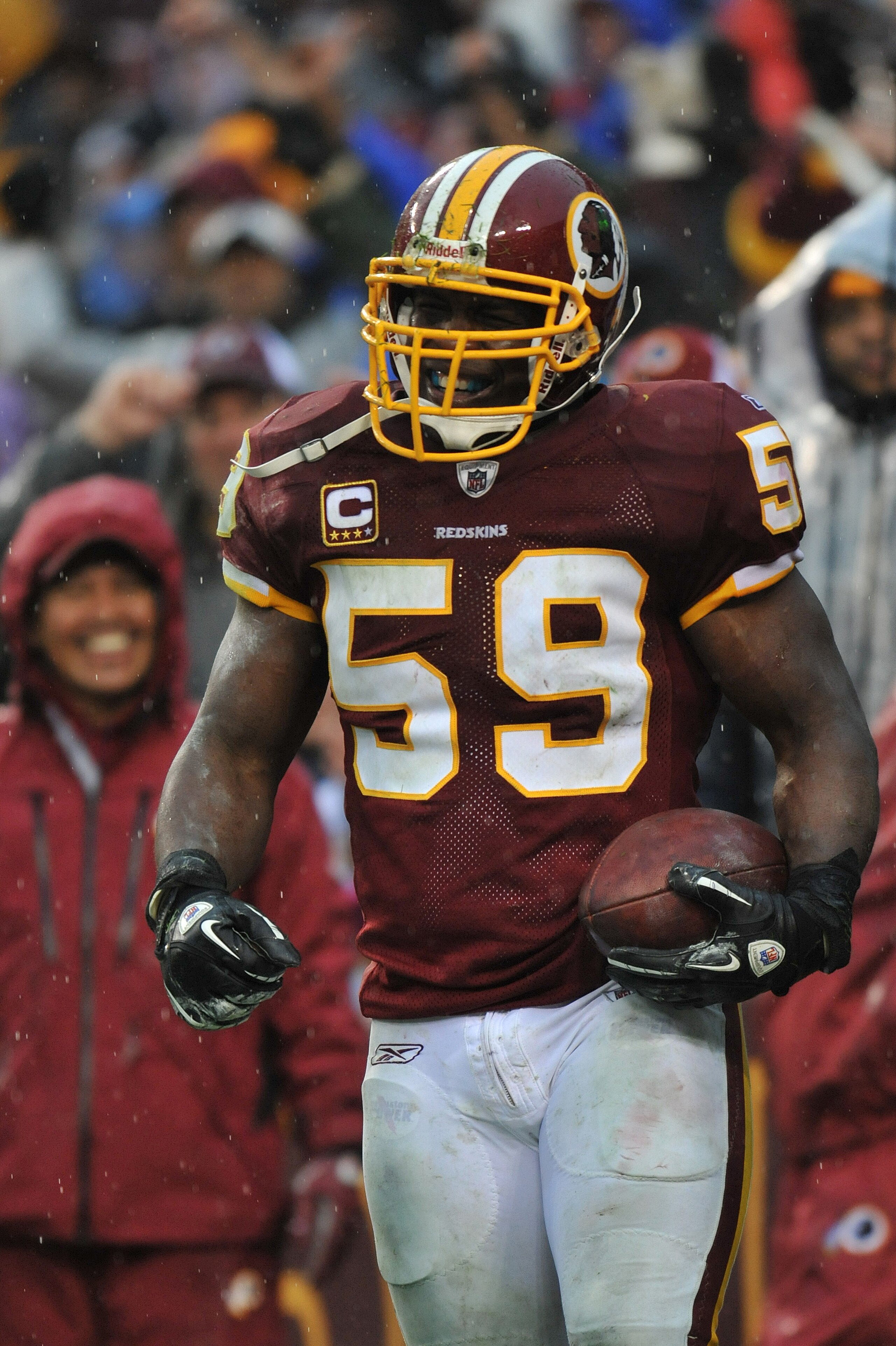 LANDOVER, MD - DECEMBER 12:  London Fletcher #59 of the Washington Redskins celebrates a goalline fumble recovery against the Tampa Bay Buccaneers  at FedExField on December 12, 2010 in Landover, Maryland. The Buccaneers defeated the Redskins 17-16. (Phot