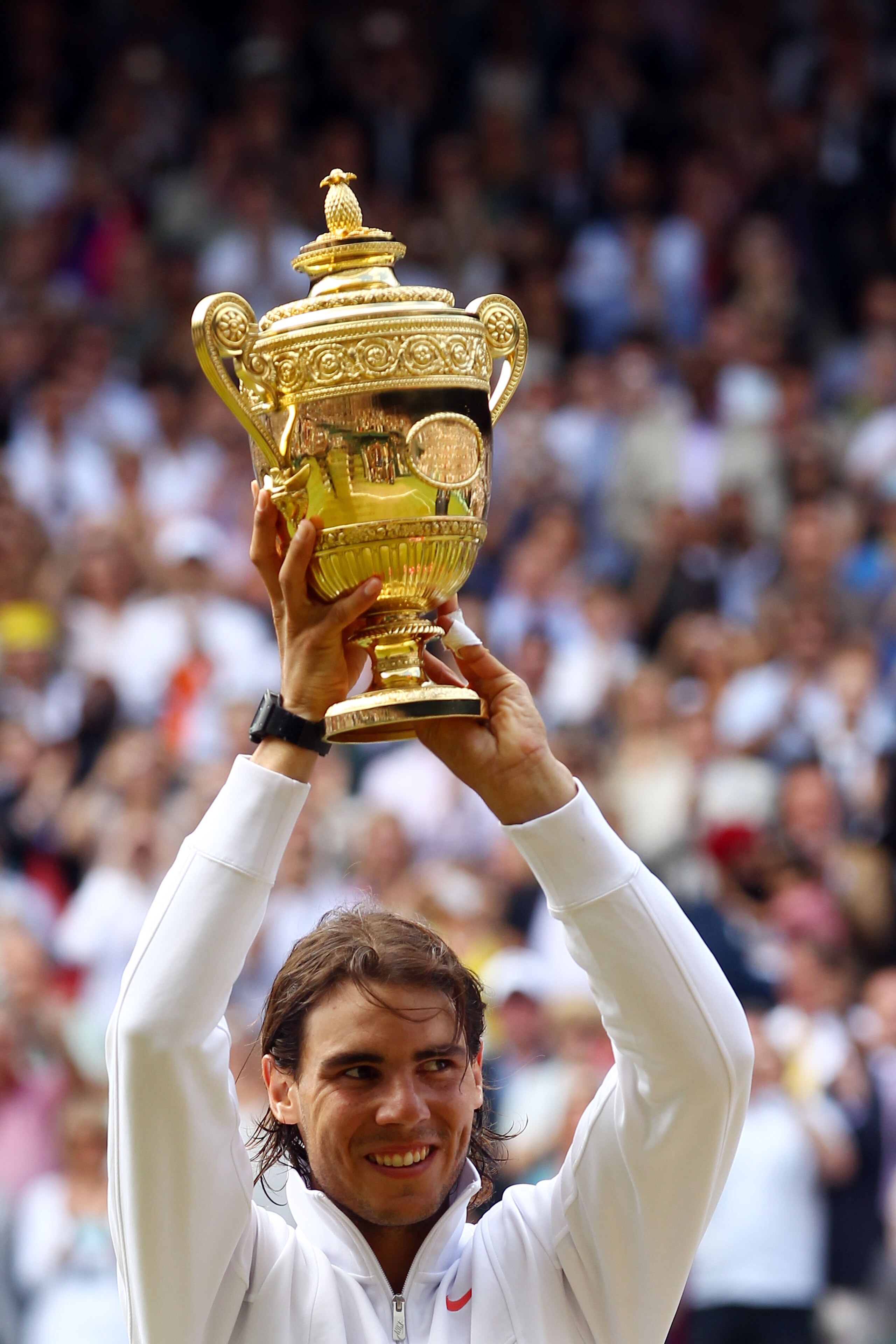 LONDON, ENGLAND - JULY 04:  Rafael Nadal of Spain holds the Championship trophy after winning the Men's Singles Final match against Tomas Berdych of Czech Republic on Day Thirteen of the Wimbledon Lawn Tennis Championships at the All England Lawn Tennis a