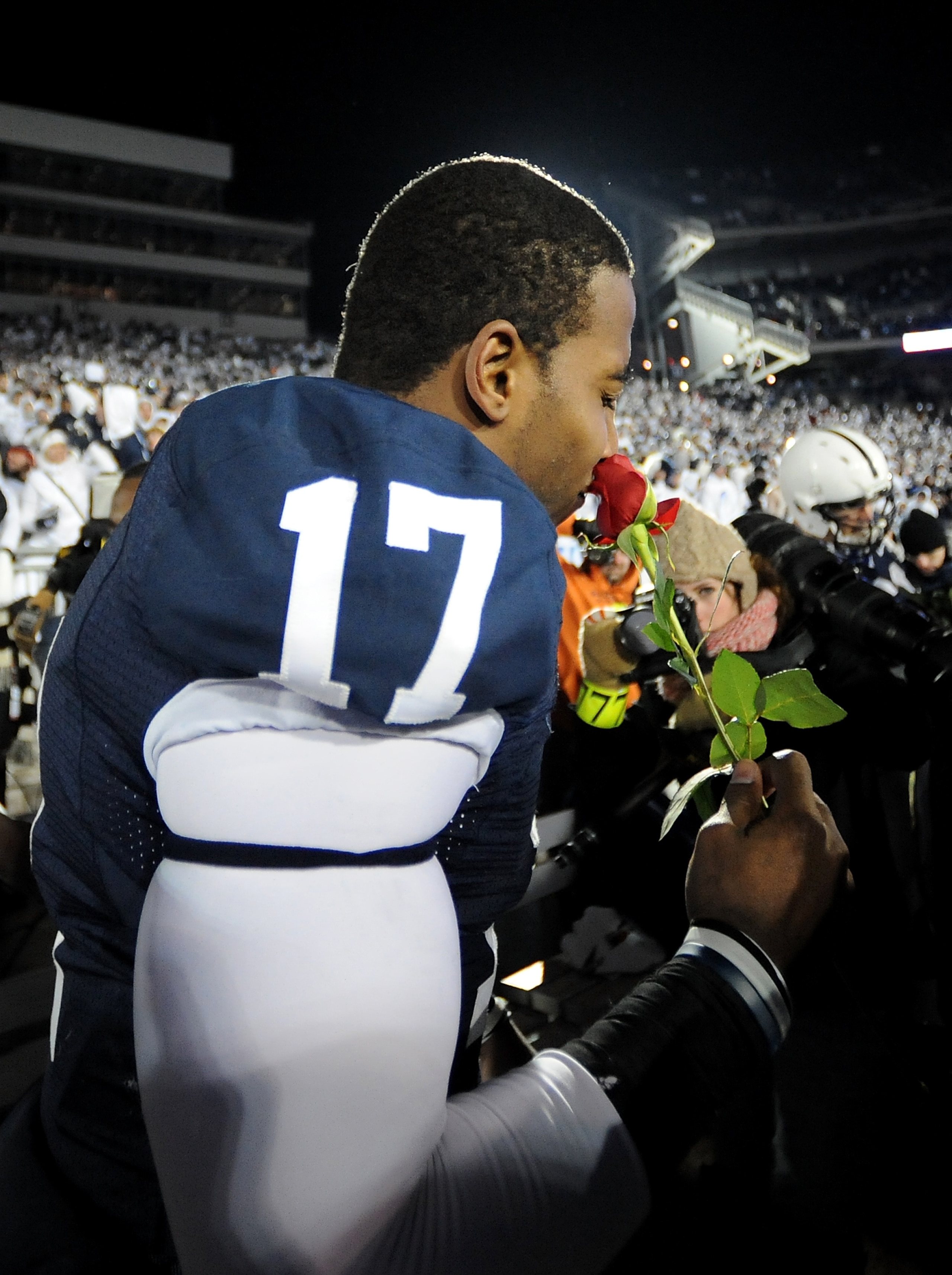 STATE COLLEGE, PA - NOVEMBER 22:  Darryl Clark #17 of the Penn State Nittany Lions smells a rose after clinching the Big Ten title and clinching a bid to the Rose Bowl after the game against the Michigan State Spartans on November 22, 2008 at Beaver Stadi
