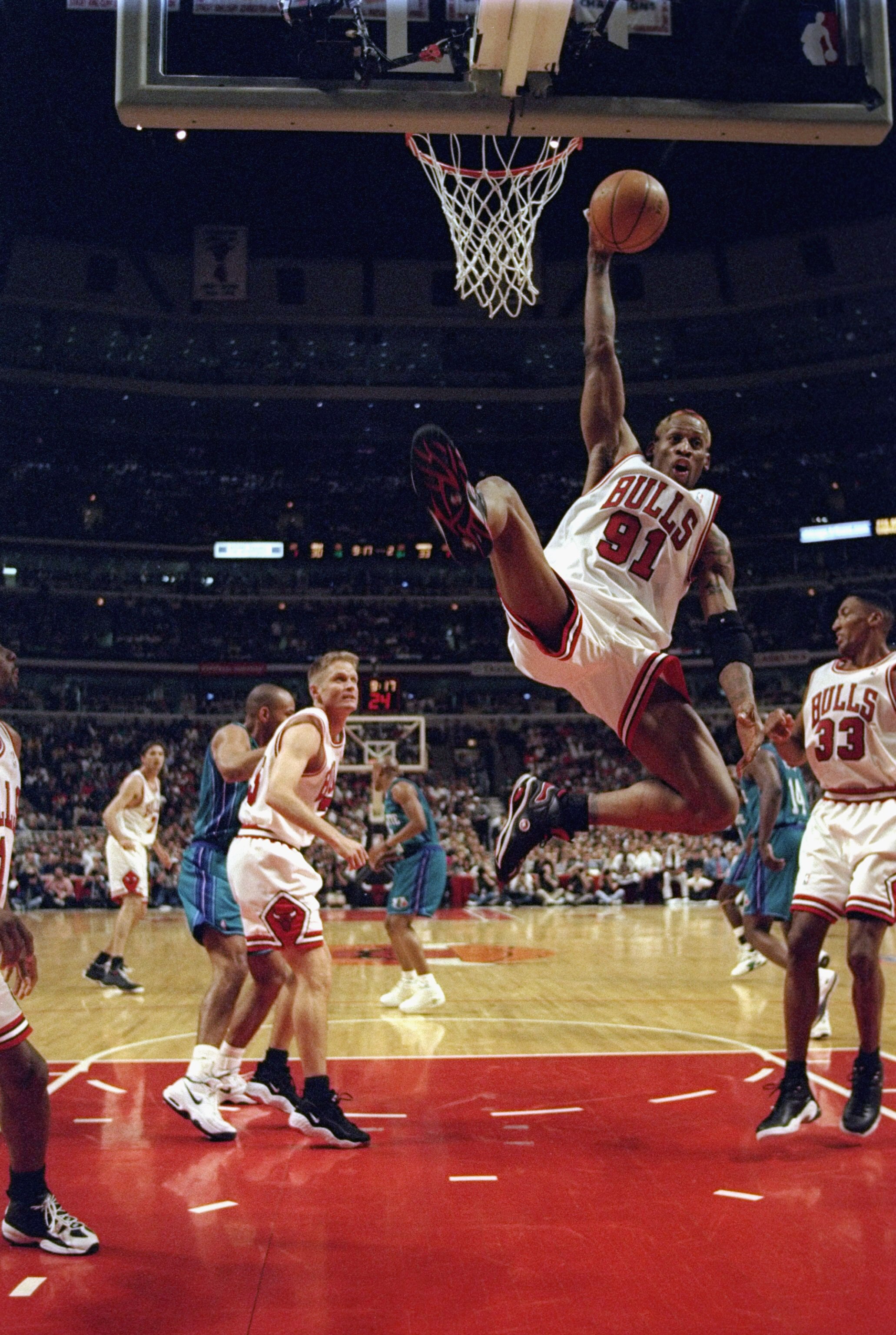 CHICAGO - MAY 13:  Dennis Rodman #91 of the Chicago Bulls collects a rebound during the 1998 NBA Eastern Conference Finals at the United Center on May 13, 1998 in Chicago, Illinois.  The Bulls defeated the Hornets 93-84.  (Photo by Jonathan Daniel/Getty I