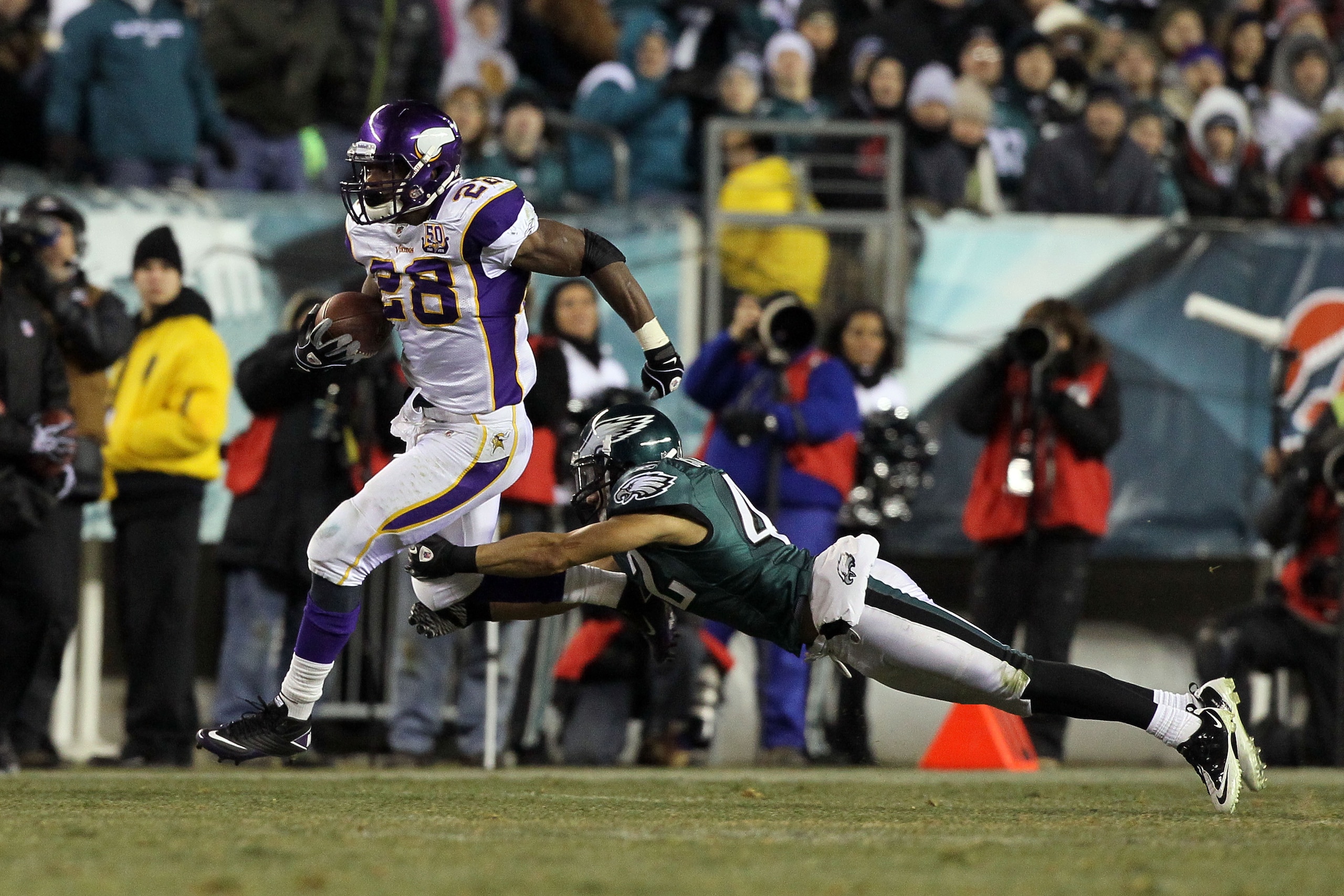 PHILADELPHIA, PA - DECEMBER 26:  Adrian Peterson #28 of the Minnesota Vikings runs against Kurt Coleman #42 of the Philadelphia Eagles at Lincoln Financial Field on December 26, 2010 in Philadelphia, Pennsylvania.  (Photo by Jim McIsaac/Getty Images)