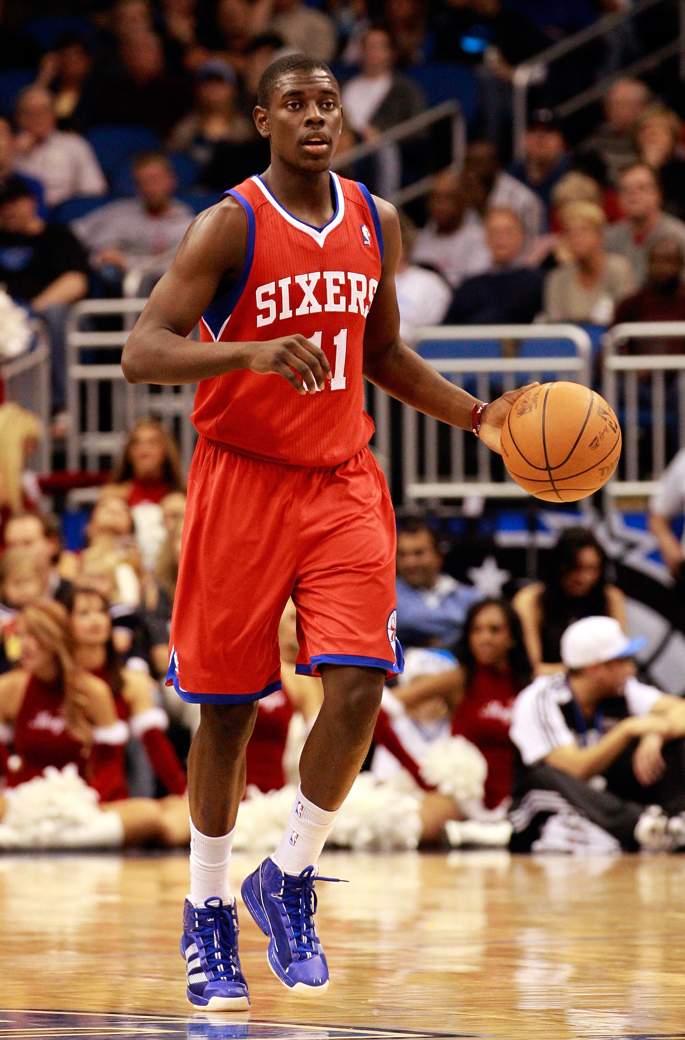 ORLANDO, FL - DECEMBER 18:  Jrue Holiday #11 of the Philadelphia 76ers brings the ball up the court during the game against the Orlando Magic at Amway Arena on December 18, 2010 in Orlando, Florida.  NOTE TO USER: User expressly acknowledges and agrees th