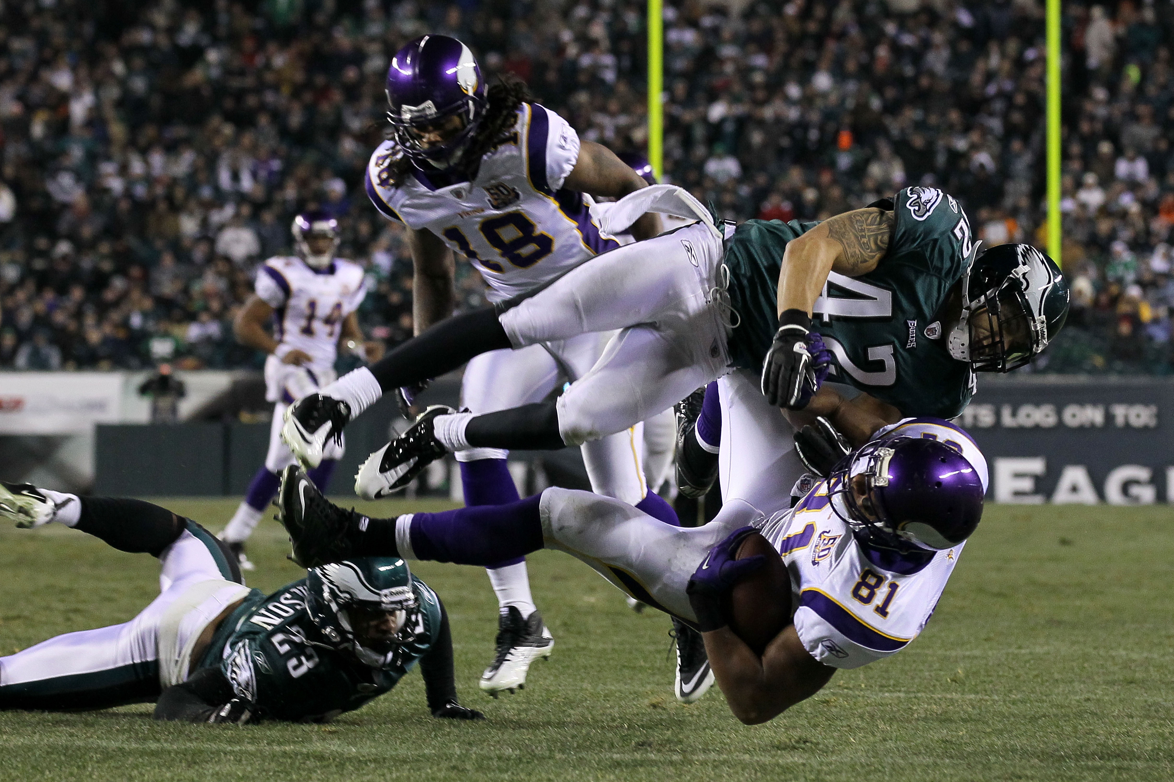 PHILADELPHIA, PA - DECEMBER 26:  Kurt Coleman #42 of the Philadelphia Eagles tackles Visanthe Shiancoe #81 of the Minnesota Vikings at Lincoln Financial Field on December 26, 2010 in Philadelphia, Pennsylvania.  (Photo by Jim McIsaac/Getty Images)