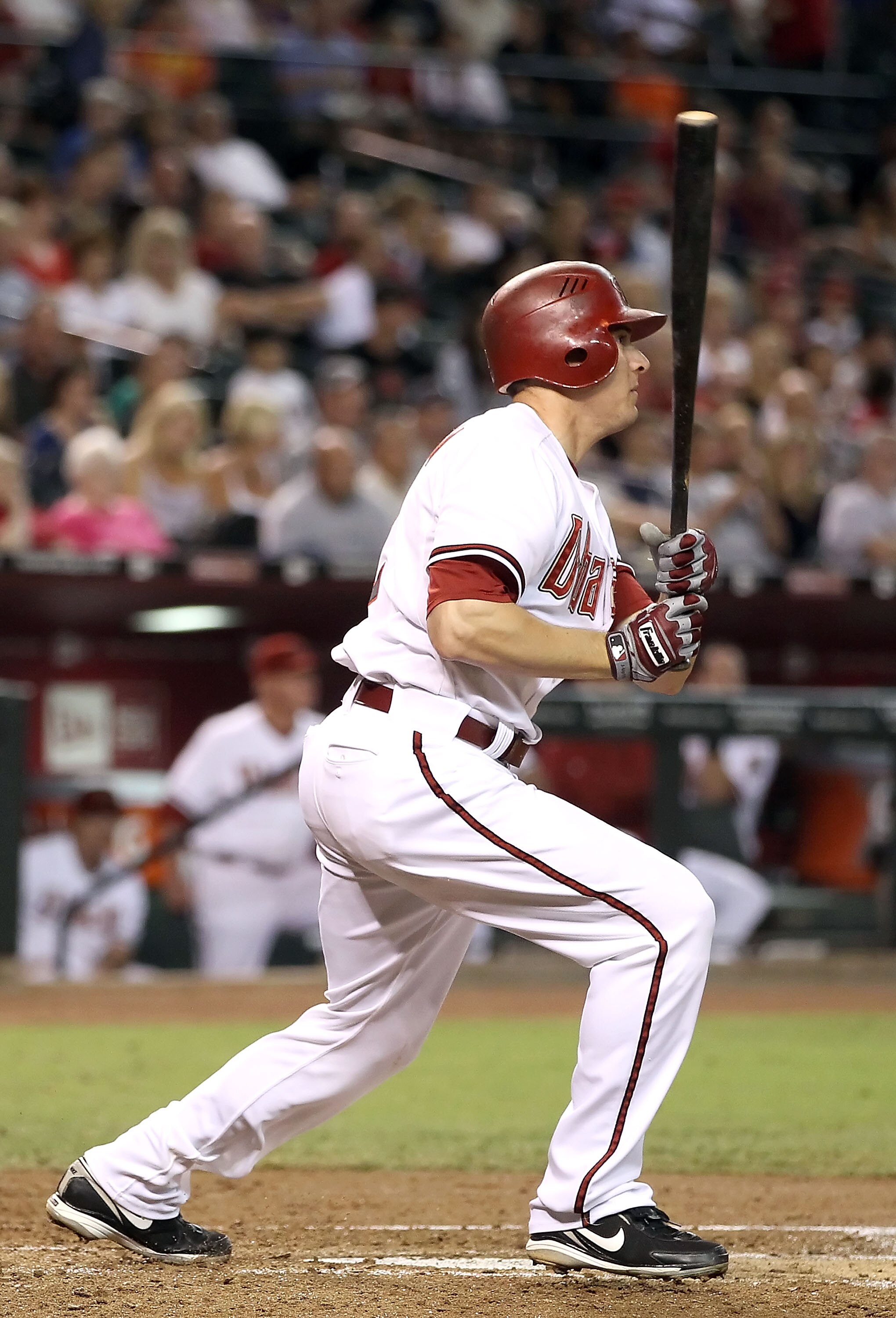 PHOENIX - SEPTEMBER 24:   Kelly Johnson #2 of the Arizona Diamondbacks hits a single against the Los Angeles Dodgers during the fourth inning of the Major League Baseball game at Chase Field on September 24, 2010 in Phoenix, Arizona.  (Photo by Christian 