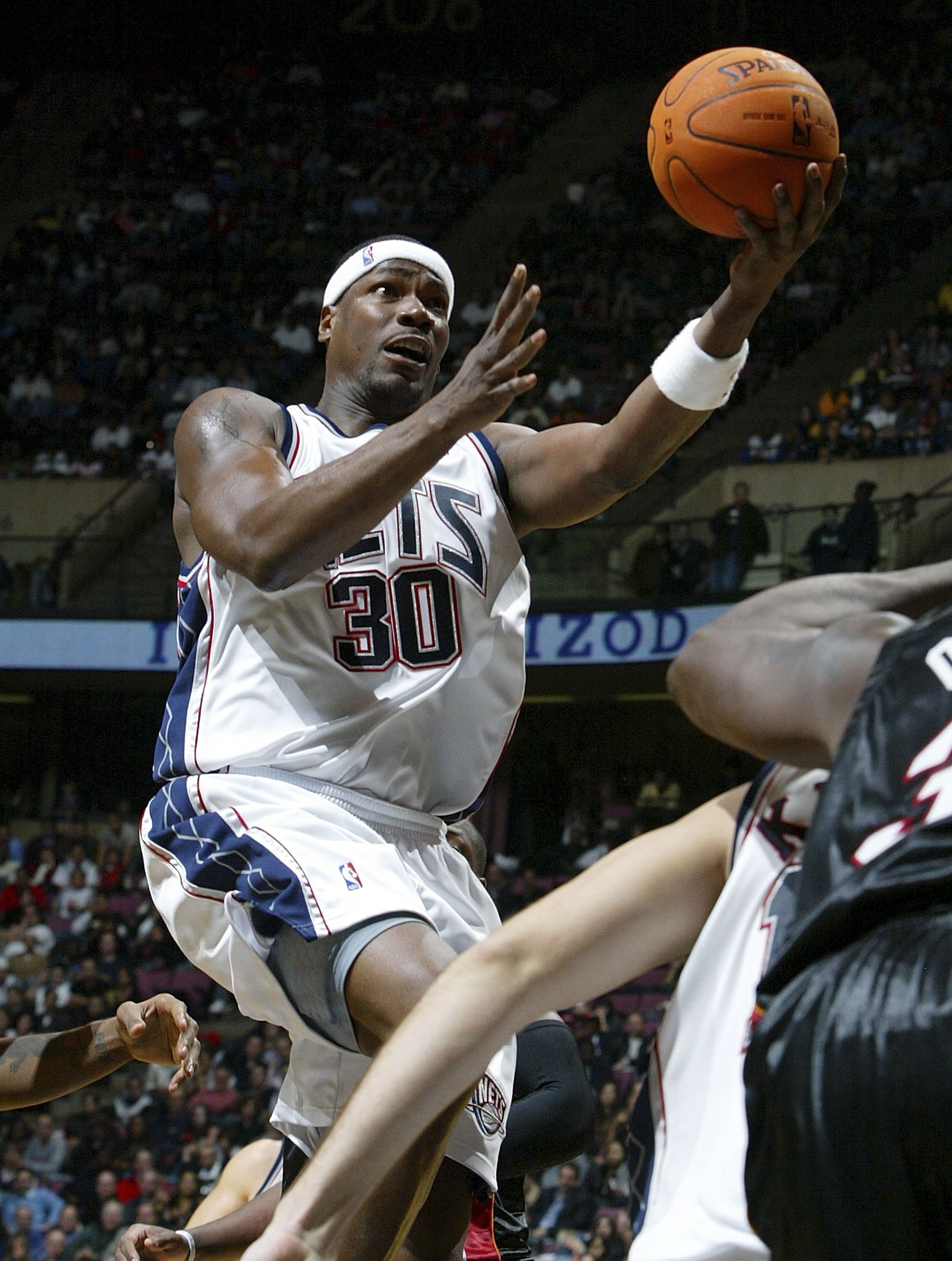 EAST RUTHERFORD, NJ - NOVEMBER 10:  Clifford Robinson #30 of the New Jersey Nets attempts a layup against the Miami Heat during their game on November 10, 2006 at Continental Airlines Arena in East Rutherford, New Jersey. NOTE TO USER: User expressly ackn