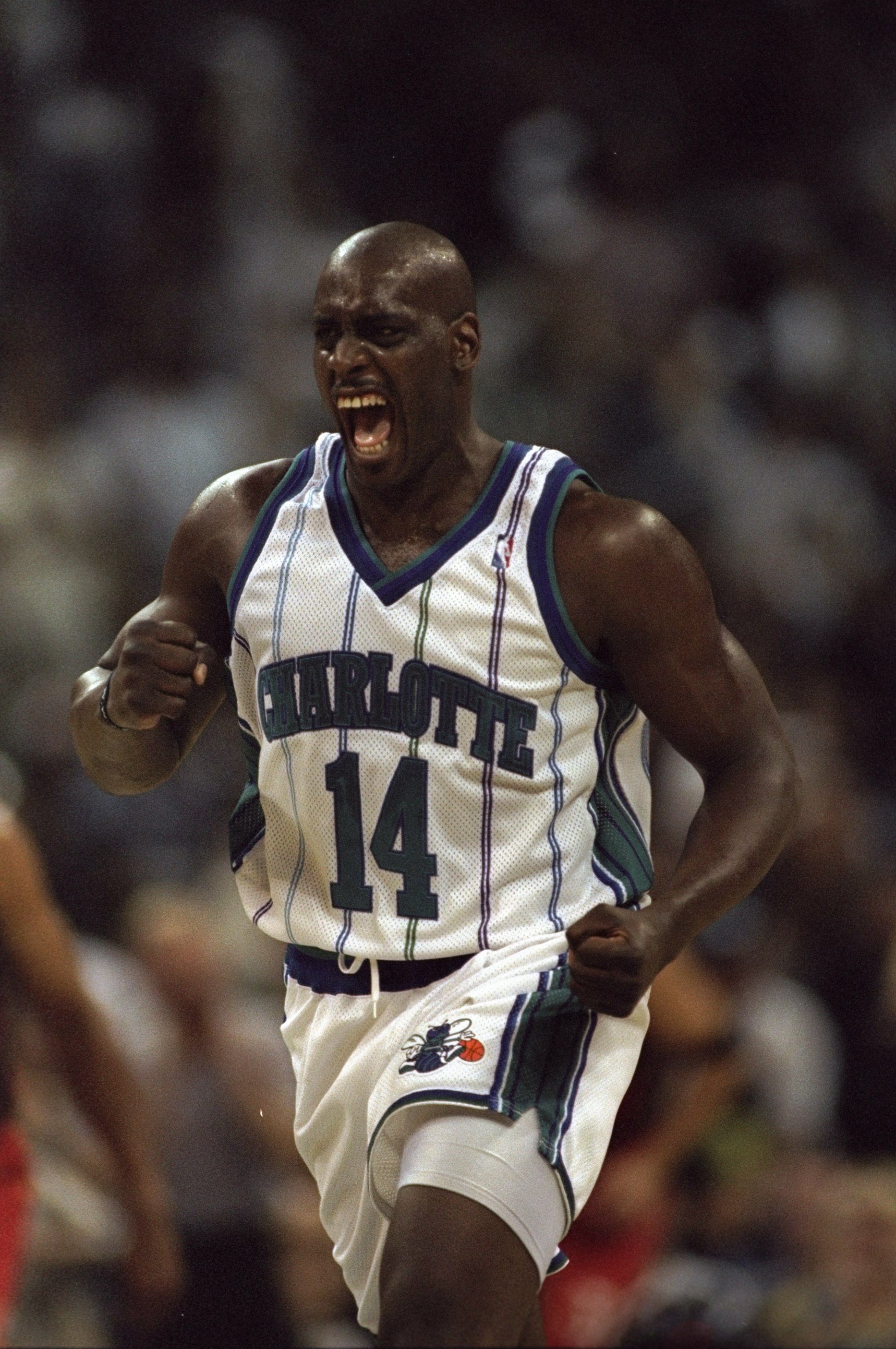 25 Apr 1998:  Anthony Mason #14 of the Charlotte Hornets celebrates during a first round Playoff Game against the Atlanta Hawks at the Charlotte Coliseum in Charlotte, North Carolina. The Hornets defeated the Hawks 92-85. Mandatory Credit: Craig Jones  /A