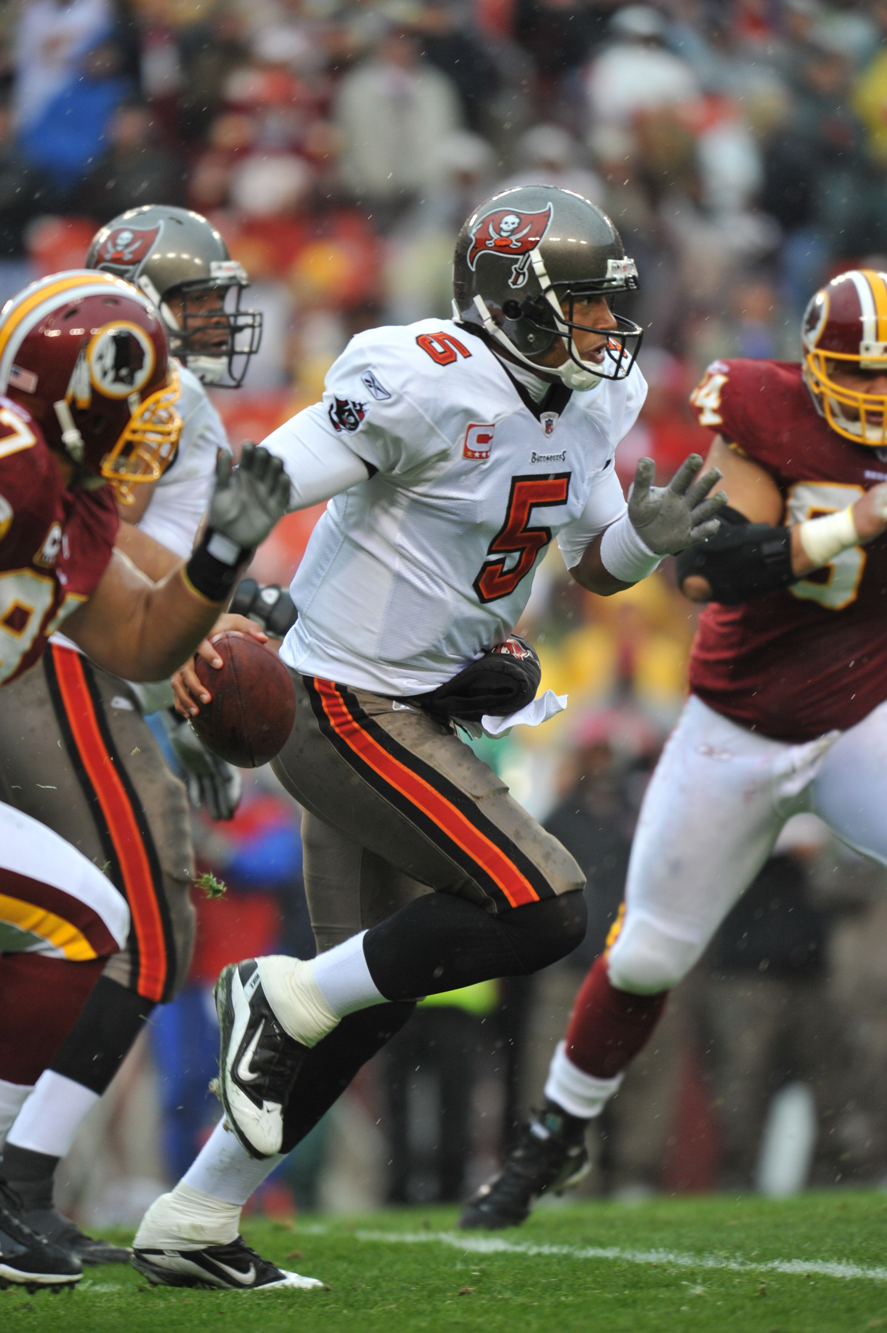 LANDOVER, MD - DECEMBER 12:  Josh Freeman #5 of the Tampa Bay Buccaneers runs the ball during the game against the Washington Redskins  at FedExField on December 12, 2010 in Landover, Maryland. The Buccaneers defeated the Redskins 17-16. (Photo by Larry F