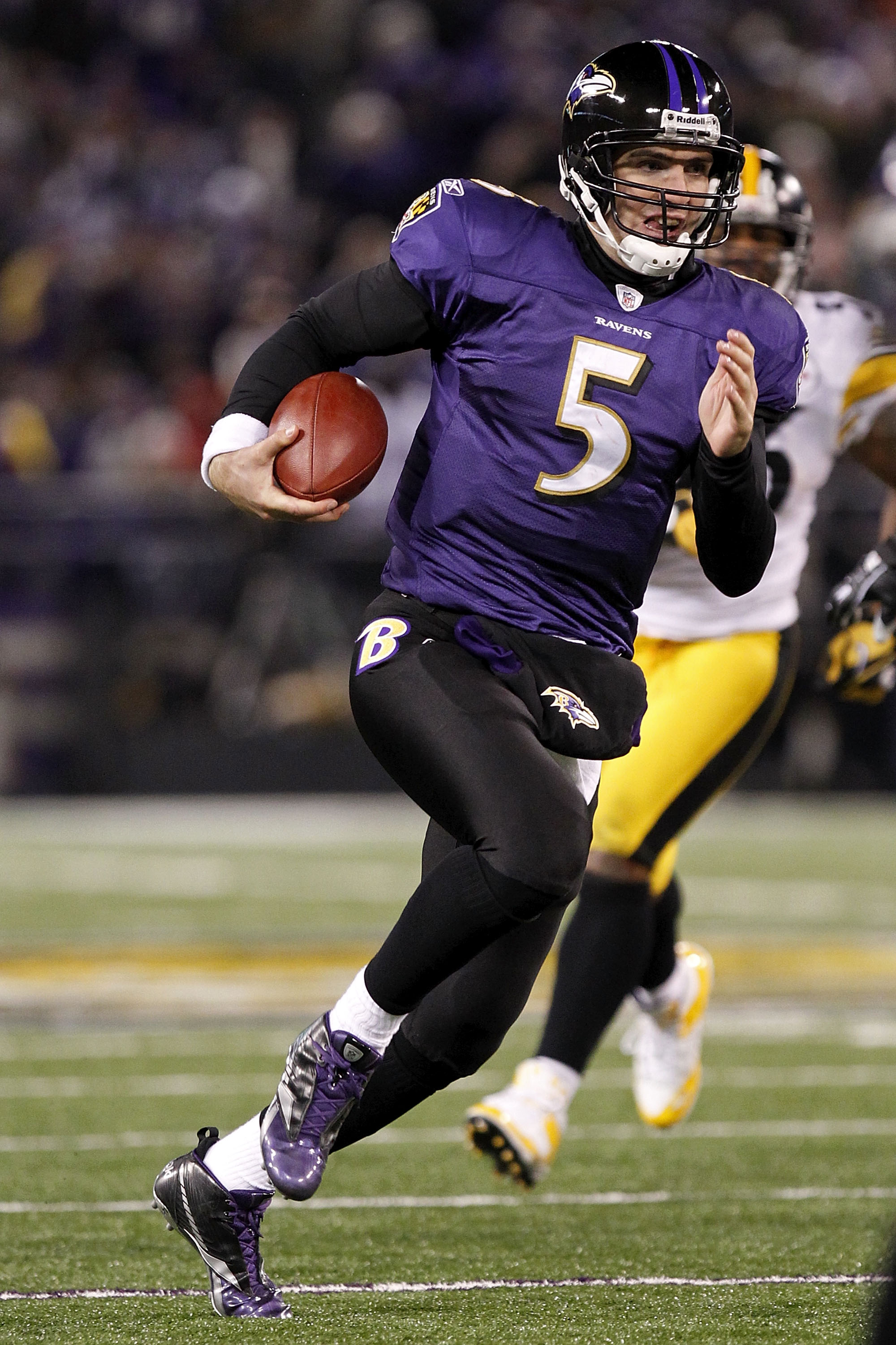 BALTIMORE, MD - DECEMBER 05:  Joe Flacco #5 of the Baltimore Ravens runs with the ball against the Pittsburgh Steelers at M&T Bank Stadium on December 5, 2010 in Baltimore, Maryland.  (Photo by Geoff Burke/Getty Images)