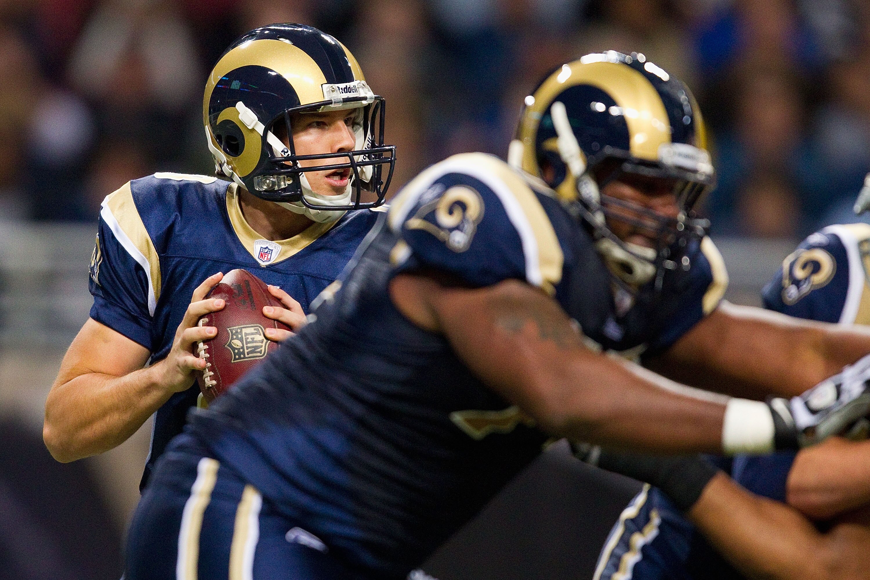 ST. LOUIS, MO - DECEMBER 26: Sam Bradford #8 of the St. Louis Rams looks to pass against the San Francisco 49ers at the Edward Jones Dome on December 26, 2010 in St. Louis, Missouri. The Rams beat the 49ers 25-17. (Photo by Dilip Vishwanat/Getty Images)
