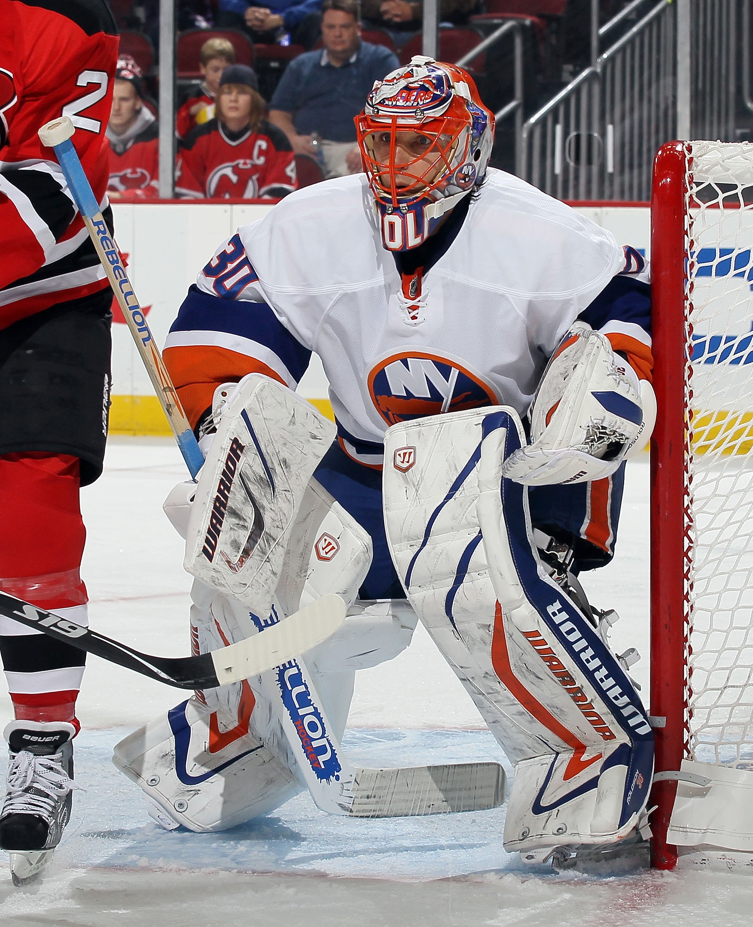 NEWARK, NJ - DECEMBER 23:  Dwayne Roloson #30 of the New York Islanders in action against the New Jersey Devils at the Prudential Center on December 23, 2010 in Newark, New Jersey.  (Photo by Jim McIsaac/Getty Images)