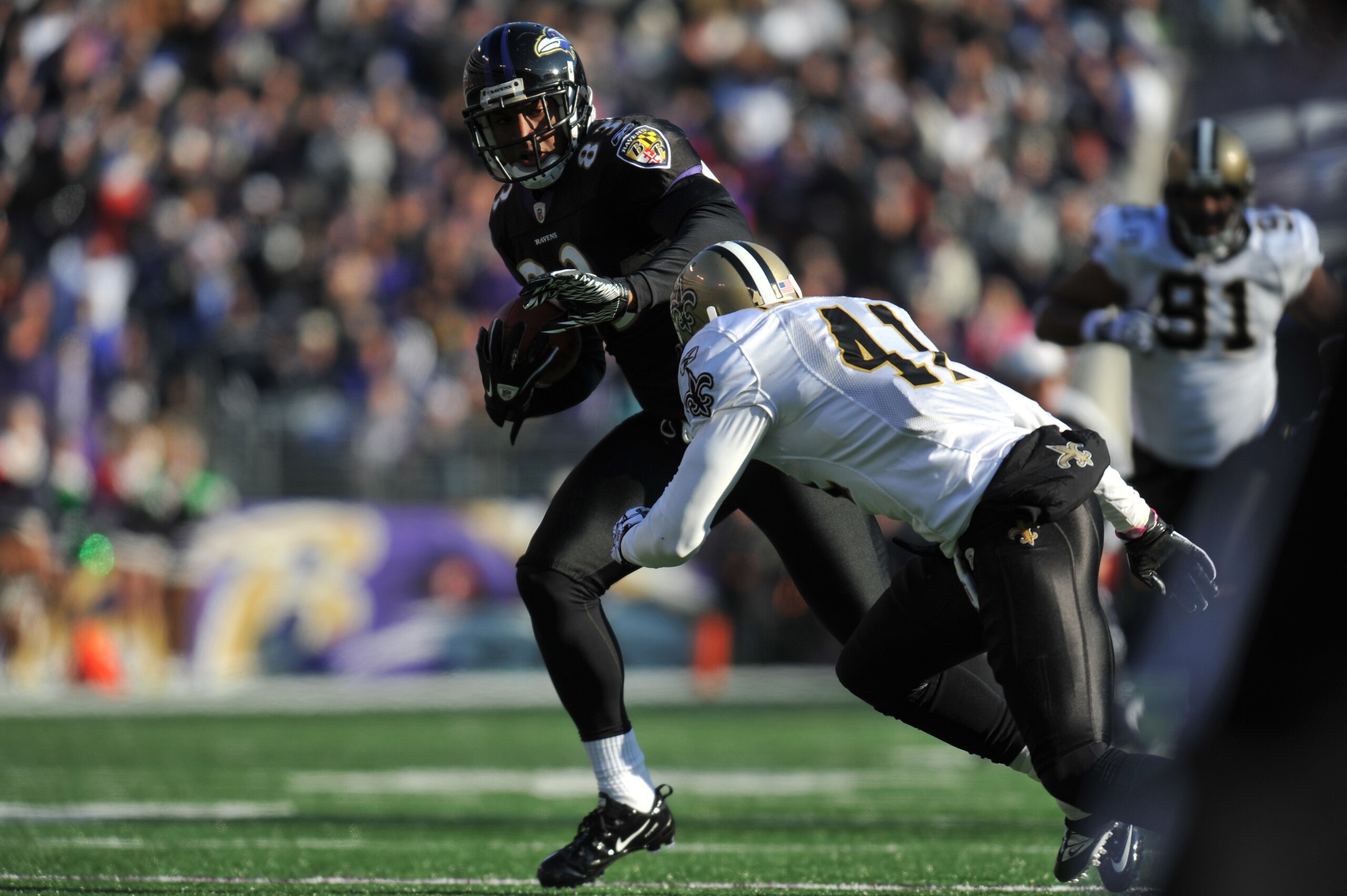 BALTIMORE, MD - DECEMBER 19:  Ed Dickson #83 of the Baltimore Ravens runs in for a touchdown against the New Orleans Saints  at M&T Bank Stadium on December 19, 2010 in Baltimore, Maryland. The Ravens lead the Saints at the half 21-14. (Photo by Larry Fre
