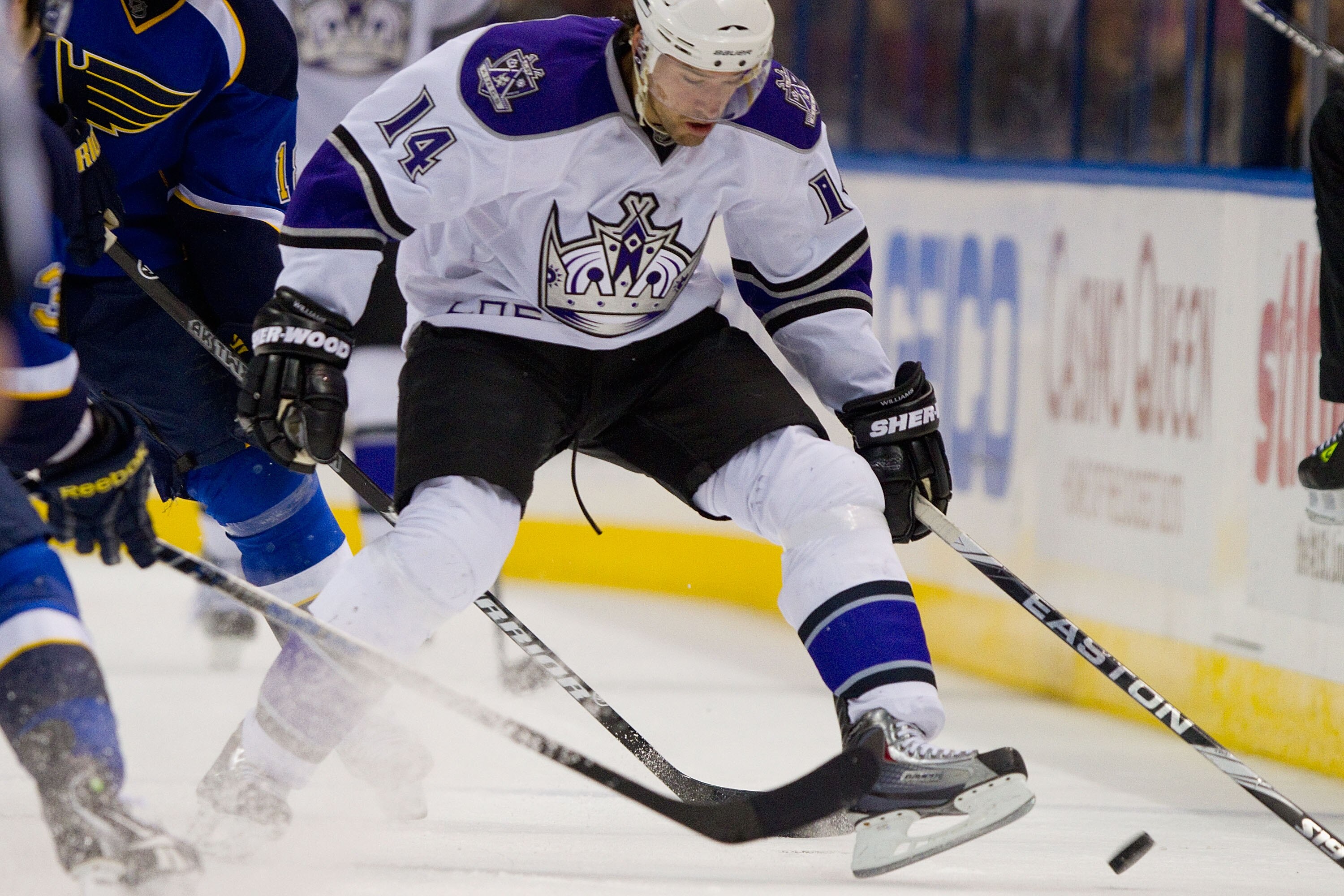 ST. LOUIS, MO - DECEMBER 16: Justin Williams #14 of the Los Angeles Kings looks to control the puck against the St. Louis Blues at the Scottrade Center on December 16, 2010 in St. Louis, Missouri.  (Photo by Dilip Vishwanat/Getty Images)